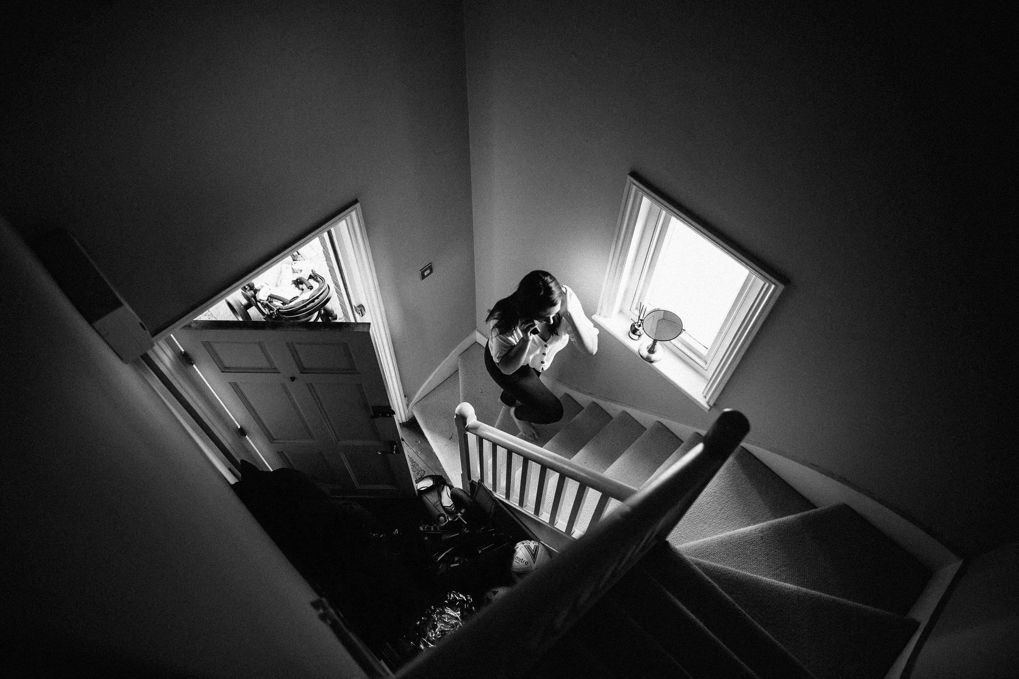  Bridesmaid walks up the stairs 