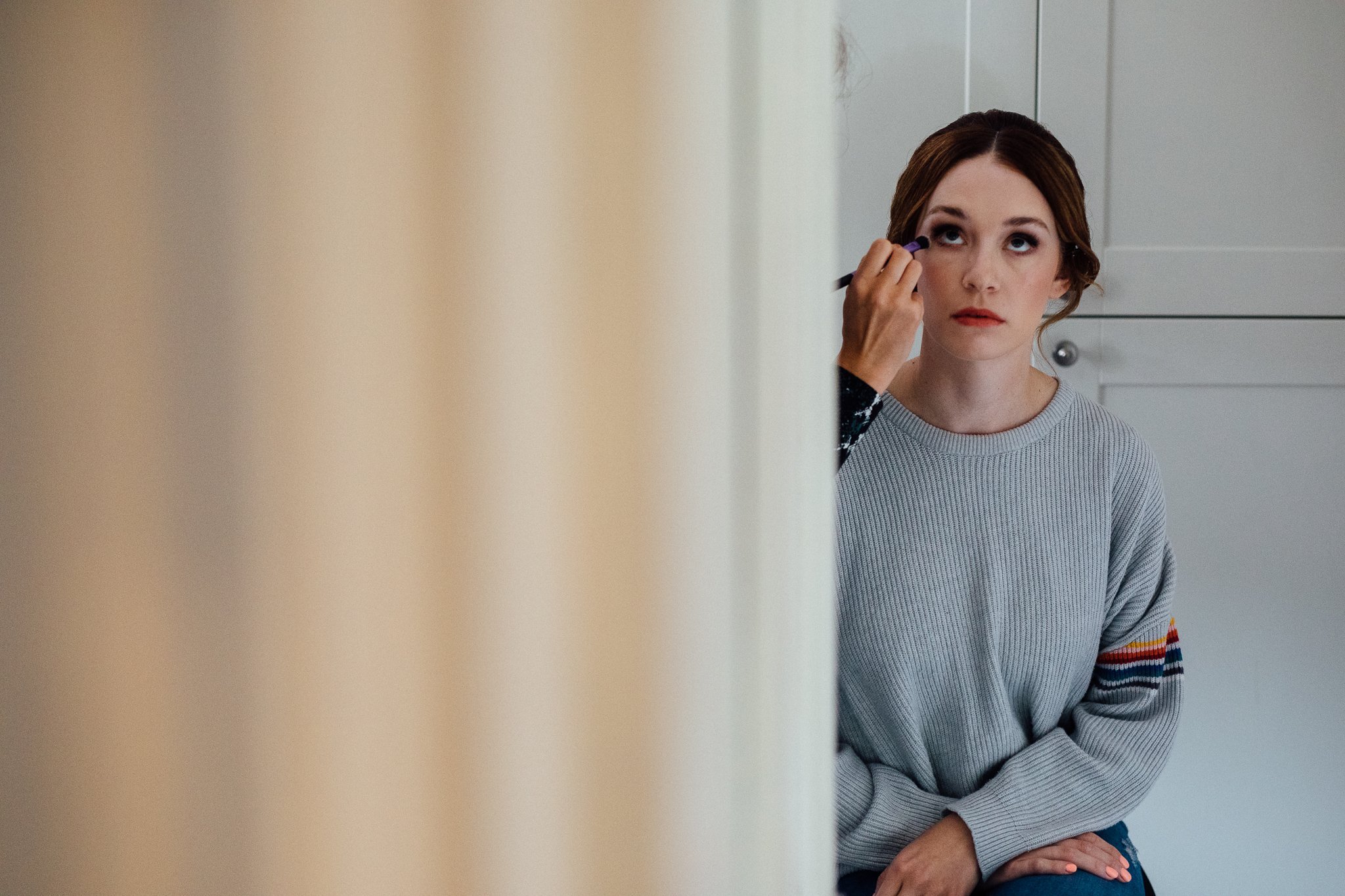  Bride having her eye makeup done. 