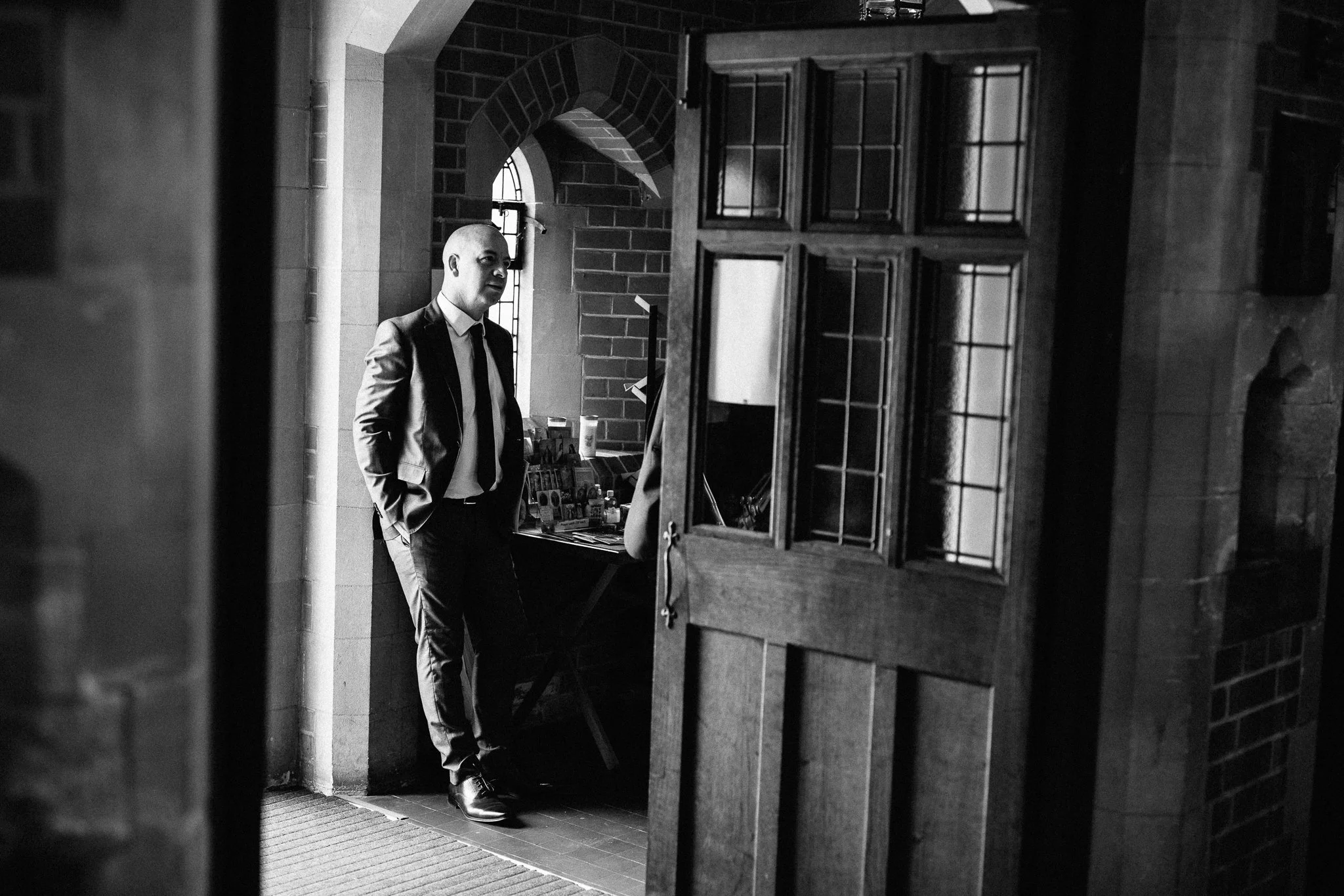  Guest relaxing against a wall in The Holy Family Church in Reigate 
