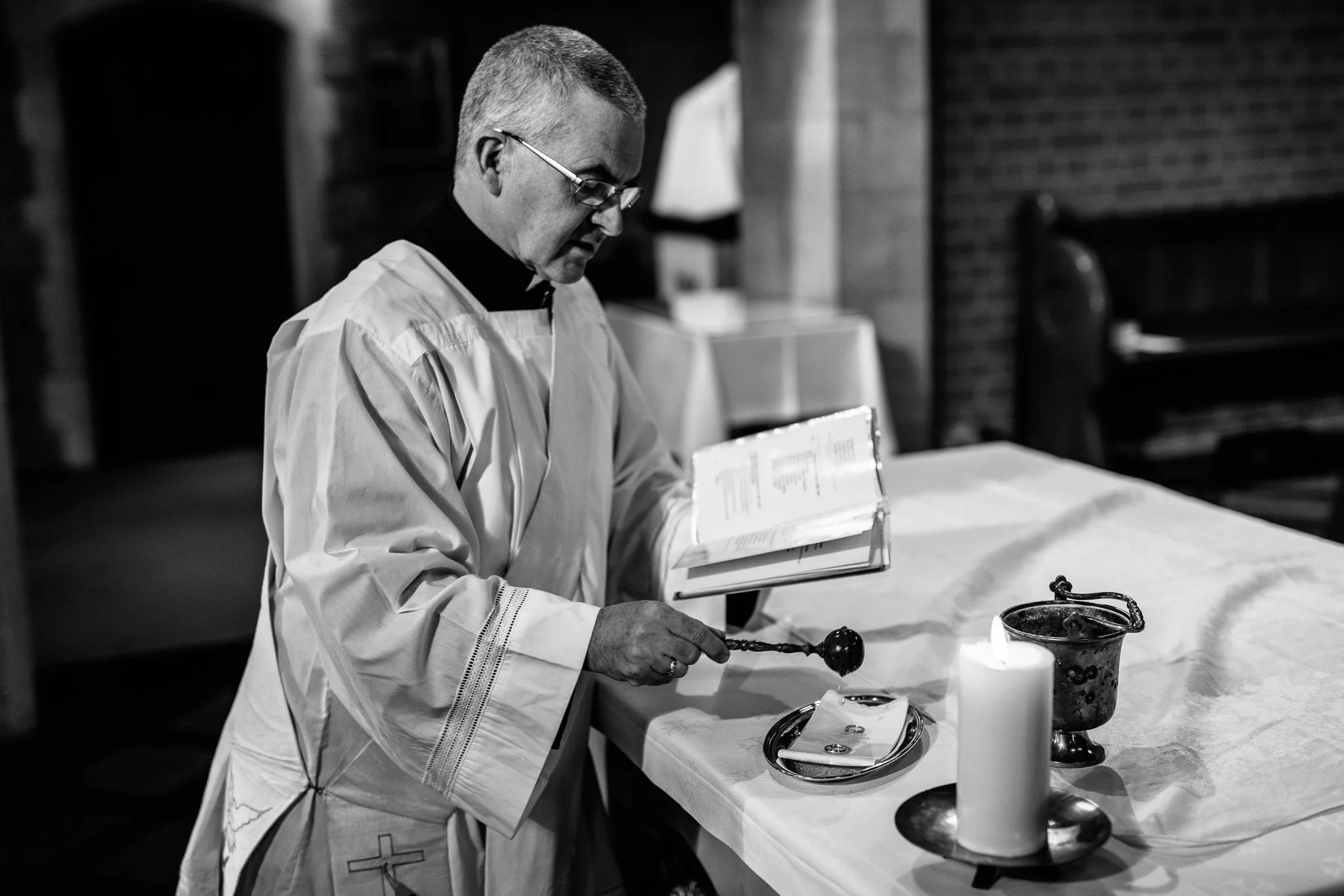  The Vicar during the ceremony at The Holy Family Church in Reigate 