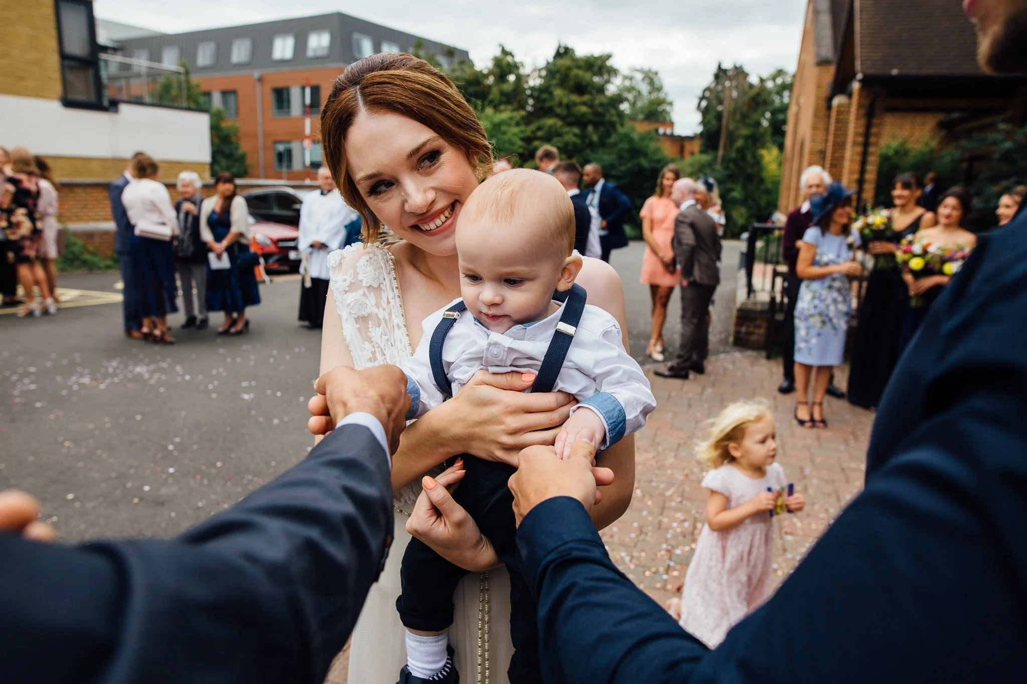  Two guests play with the Bride’s son 