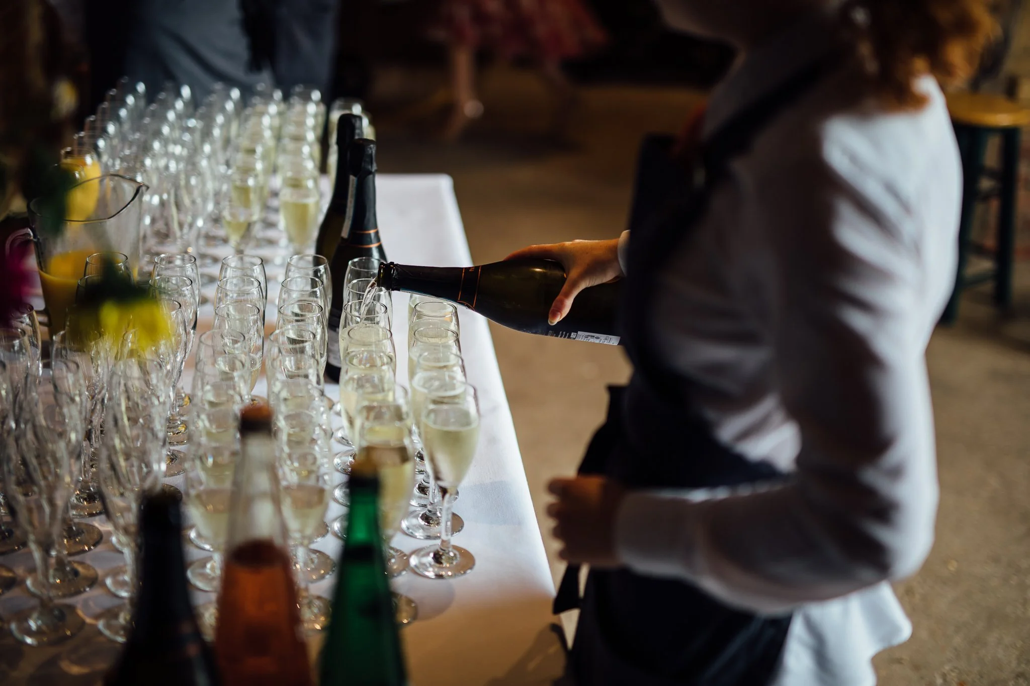  Staff pour drinks at Gildings Barns in Newdigate Surrey 