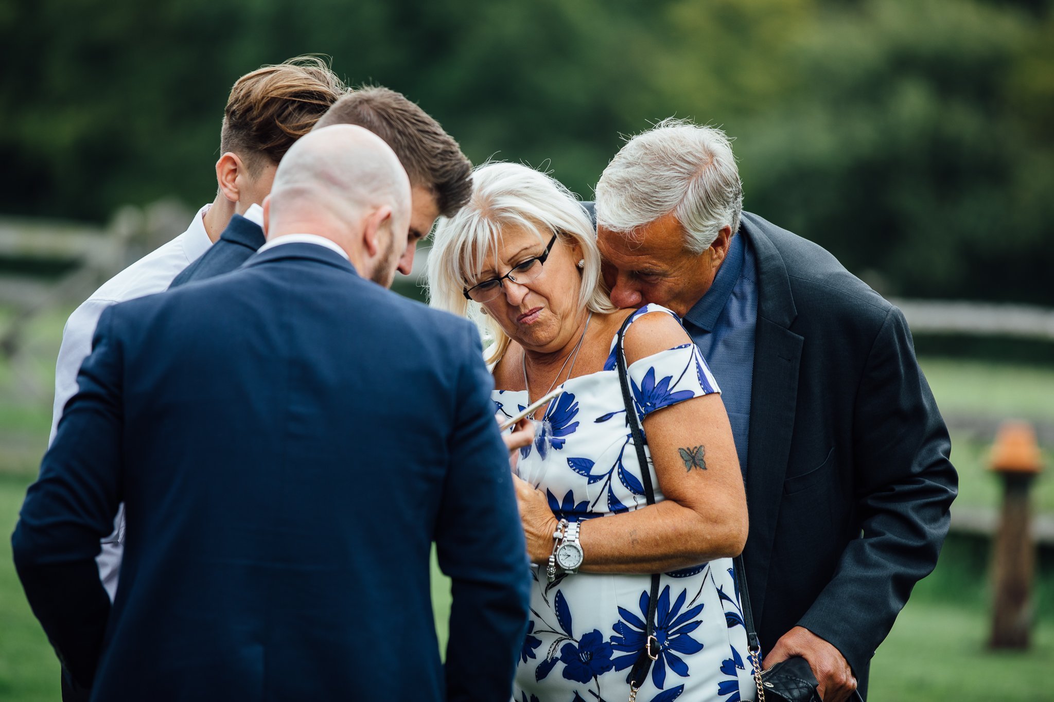  Man kisses his wife on the shoulder at Gildings Barns in Newdigate Surrey 