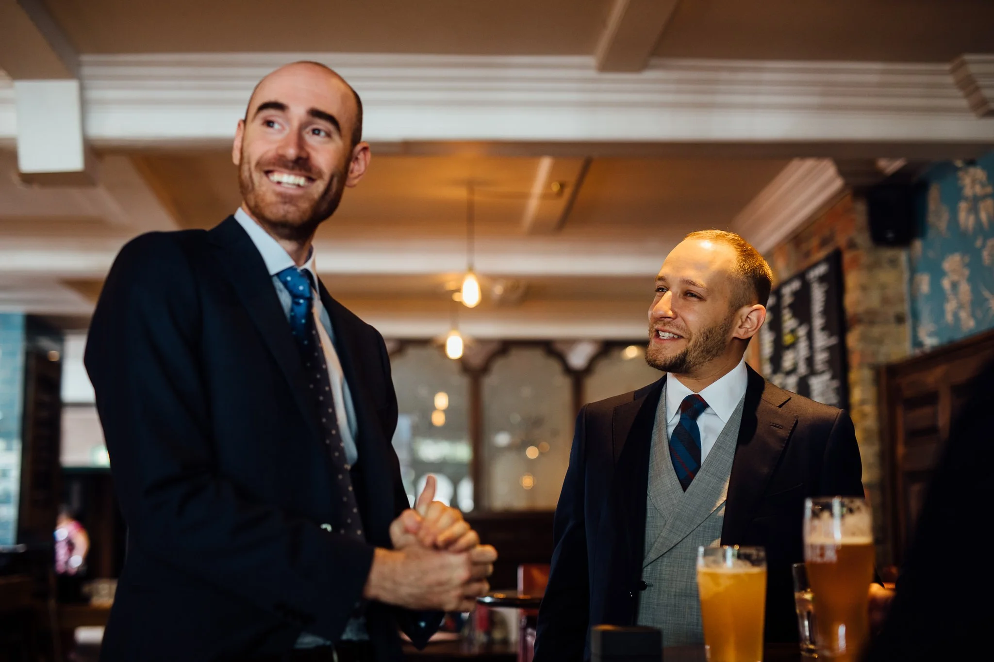  The Groom and best man enjoying a drink 