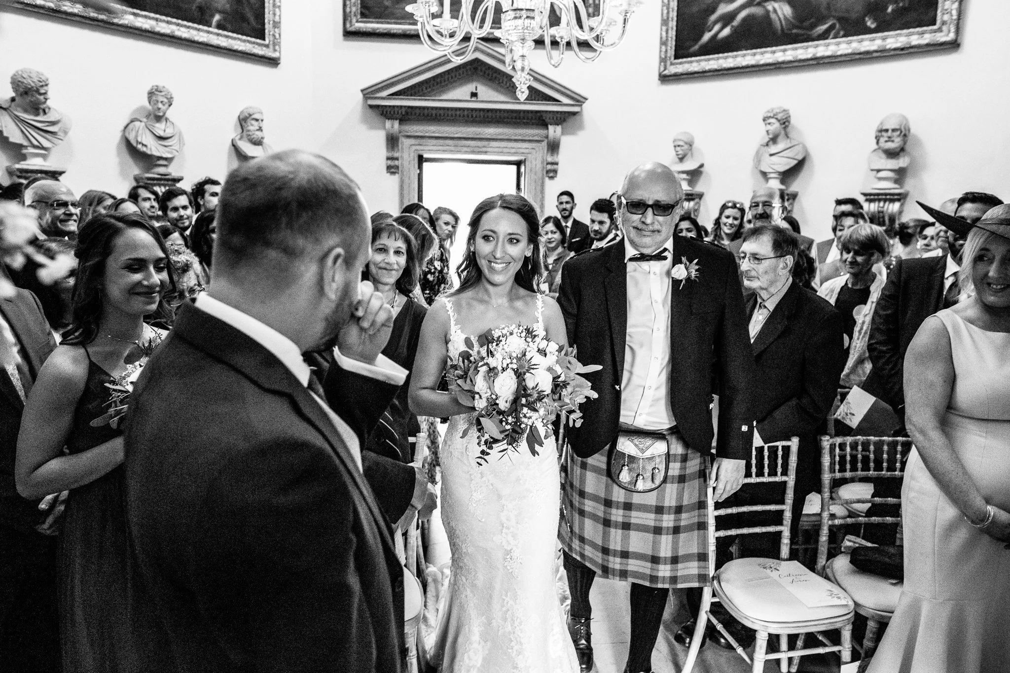  Bride smiles at the groom 