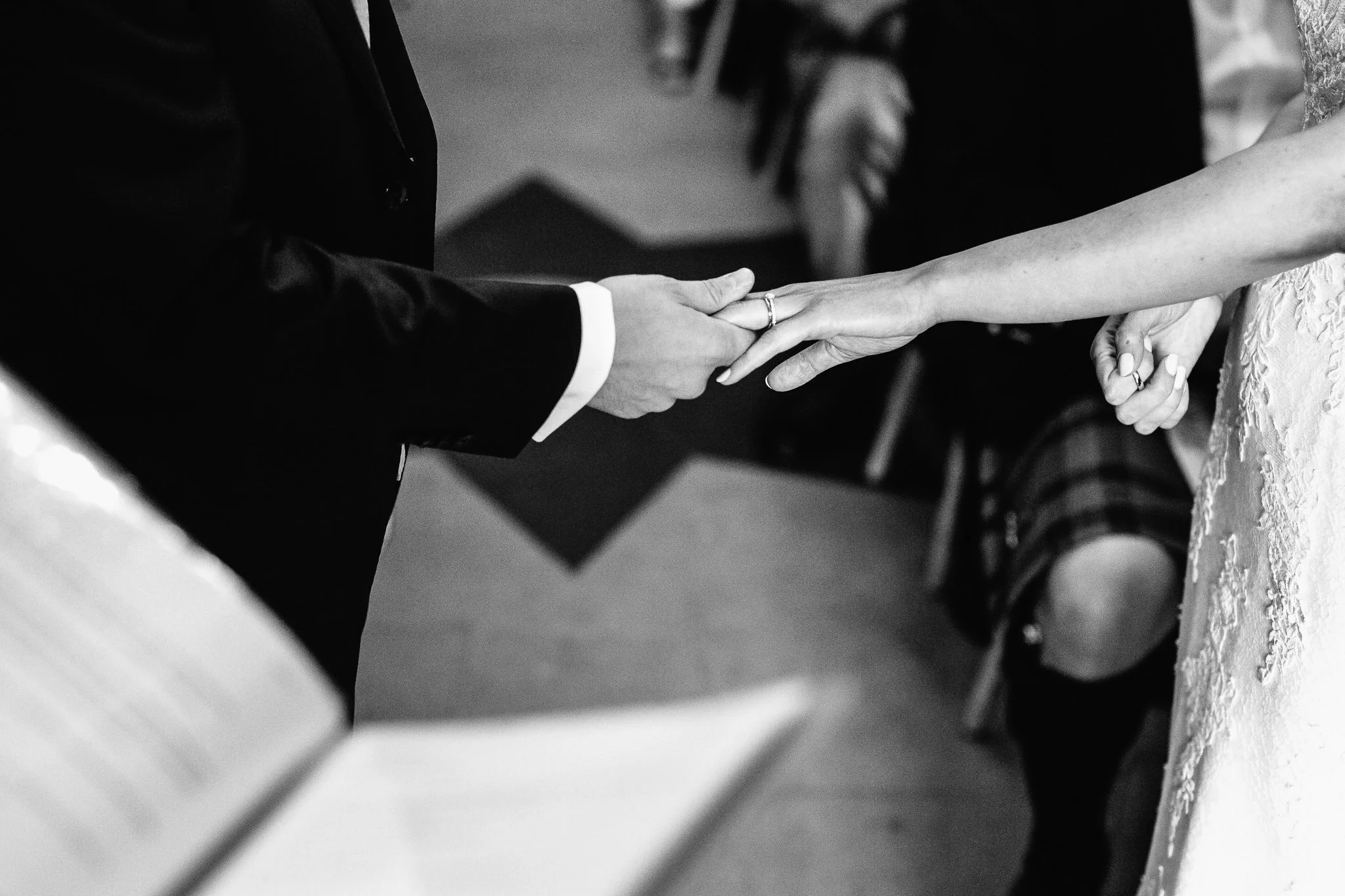  Groom puts a ring on the Bride’s finger 