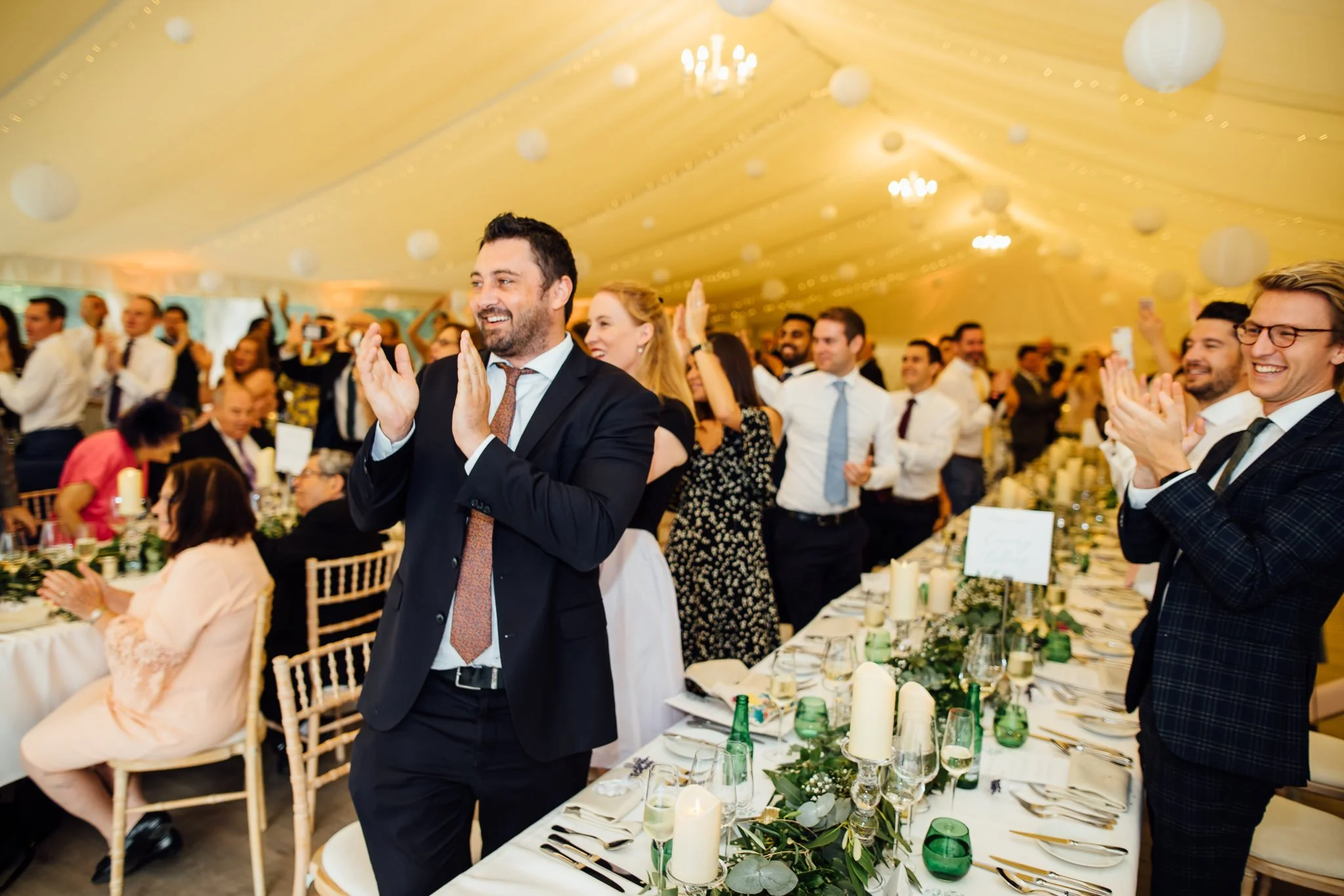  Guests applaud the entrance of the Bride and Groom 