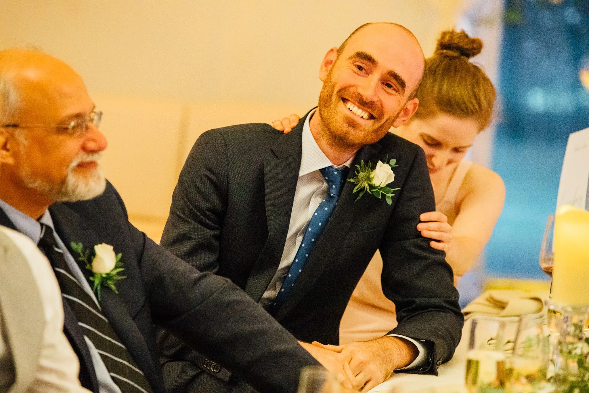  Best man smiling and laughing at the speeches 