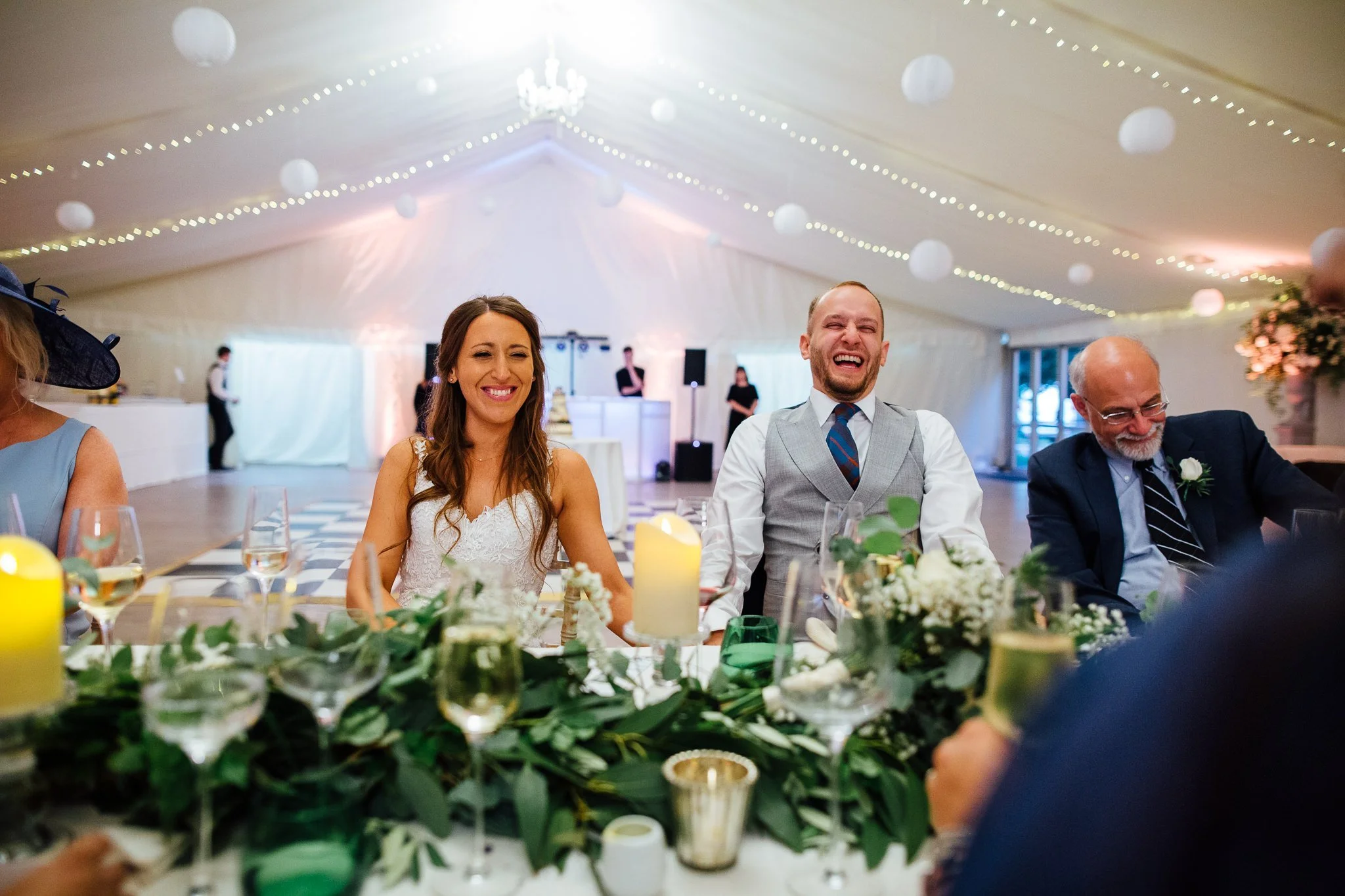  Bride and Groom laugh at the speeches 