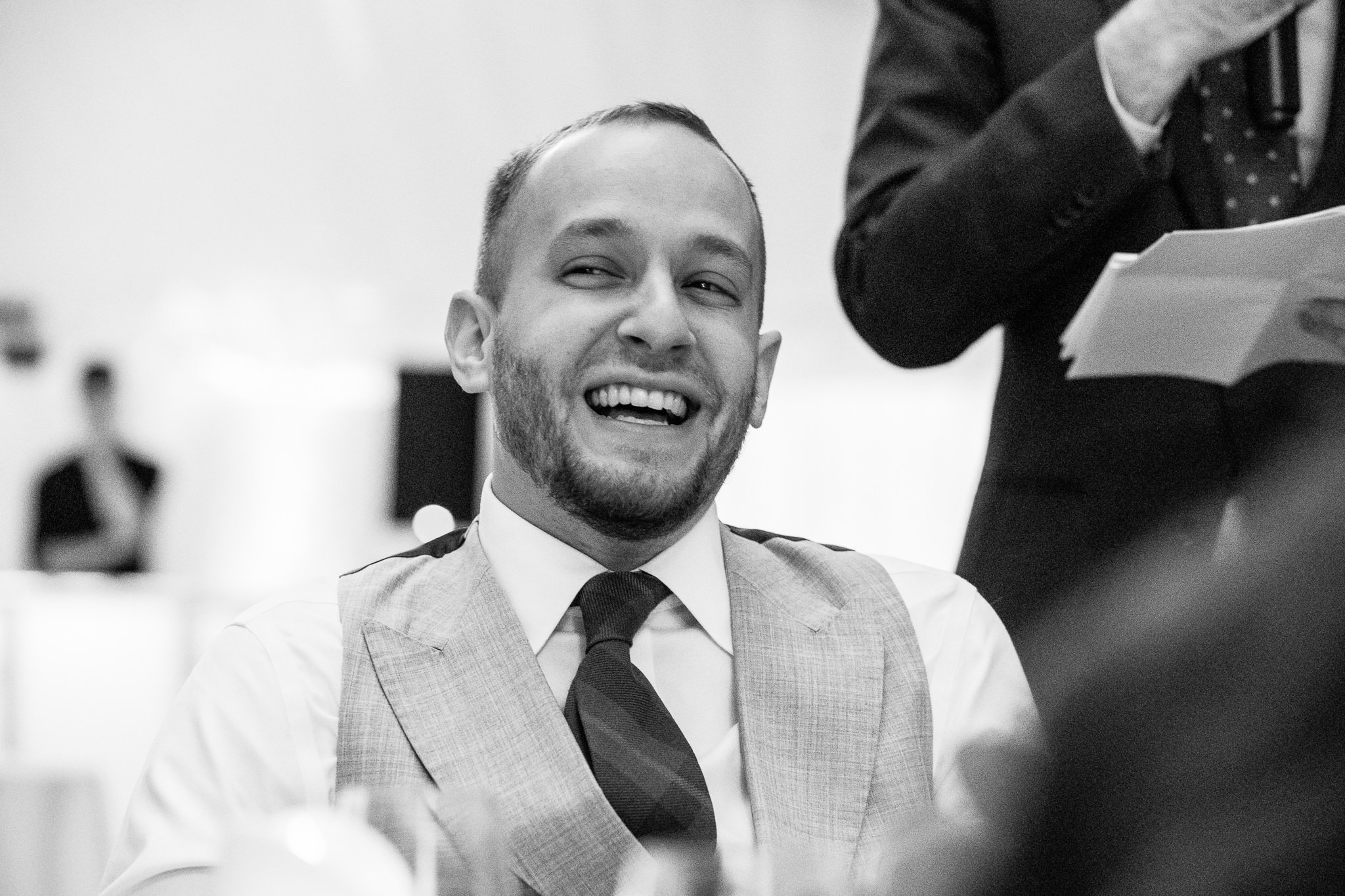  Groom laughing at the speeches 