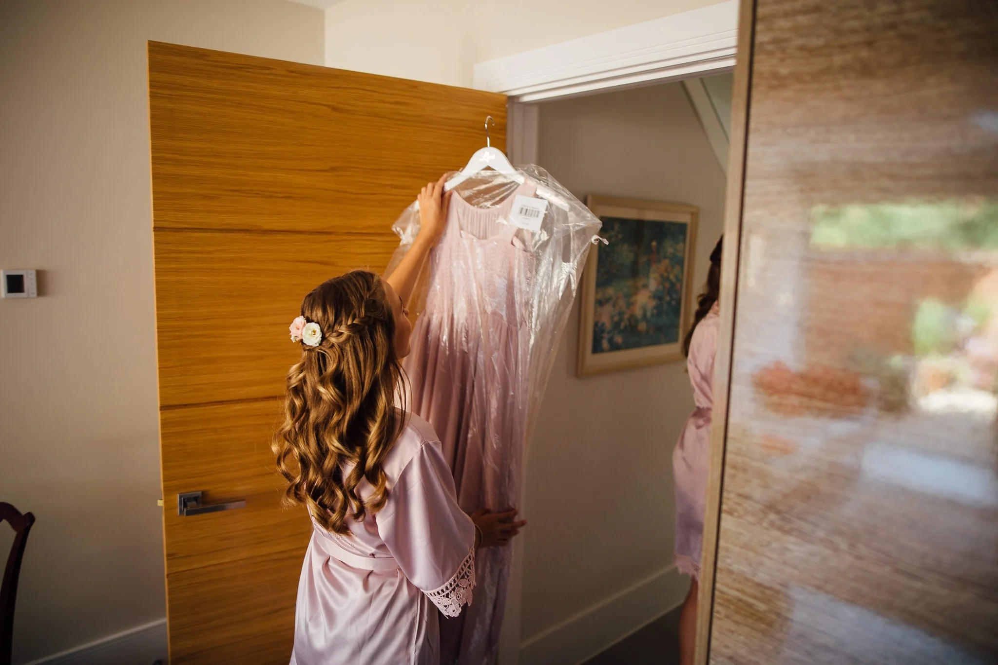  Bridesmaid carrying her dress 