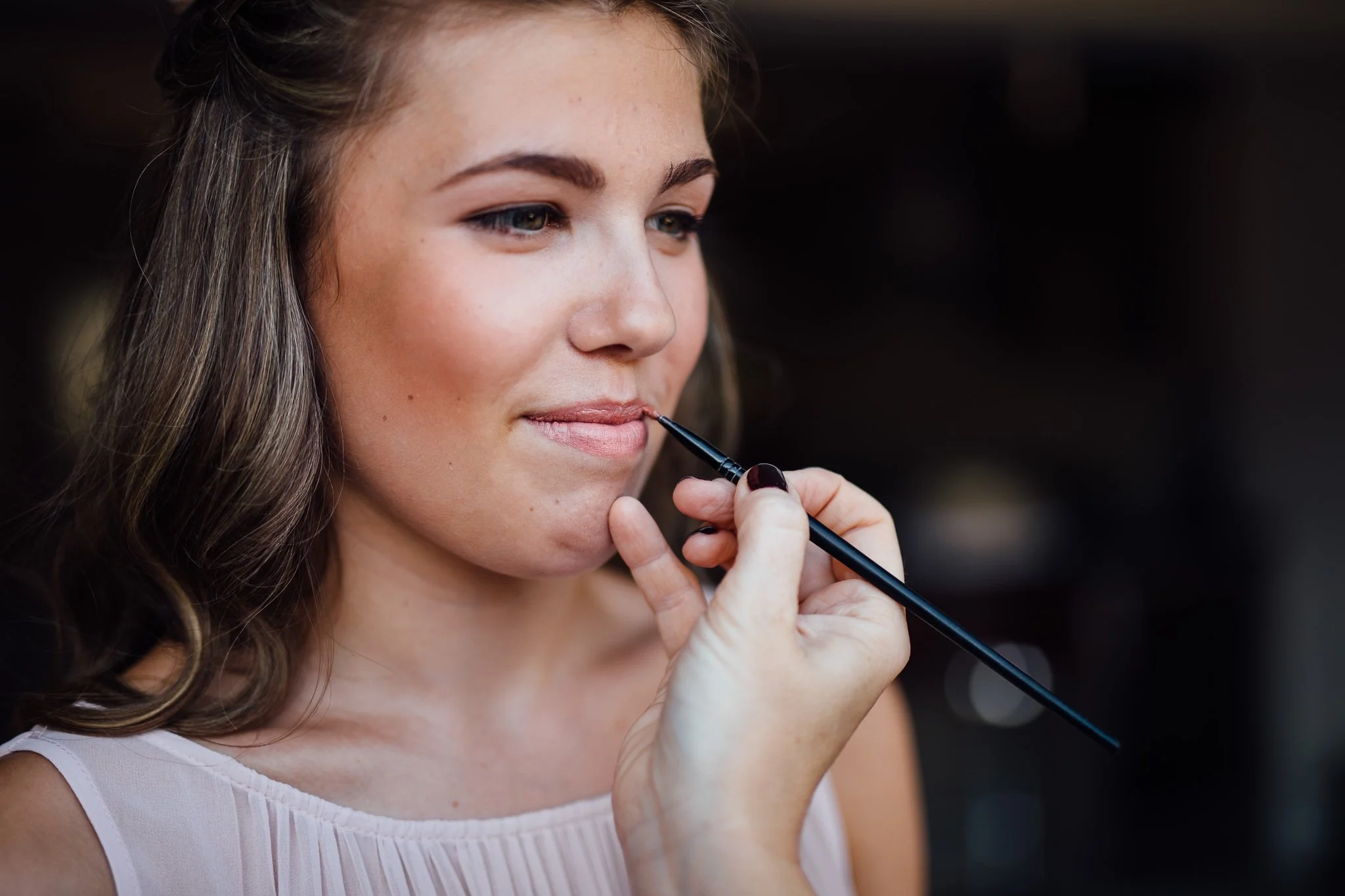  Girl has lipstick applied 
