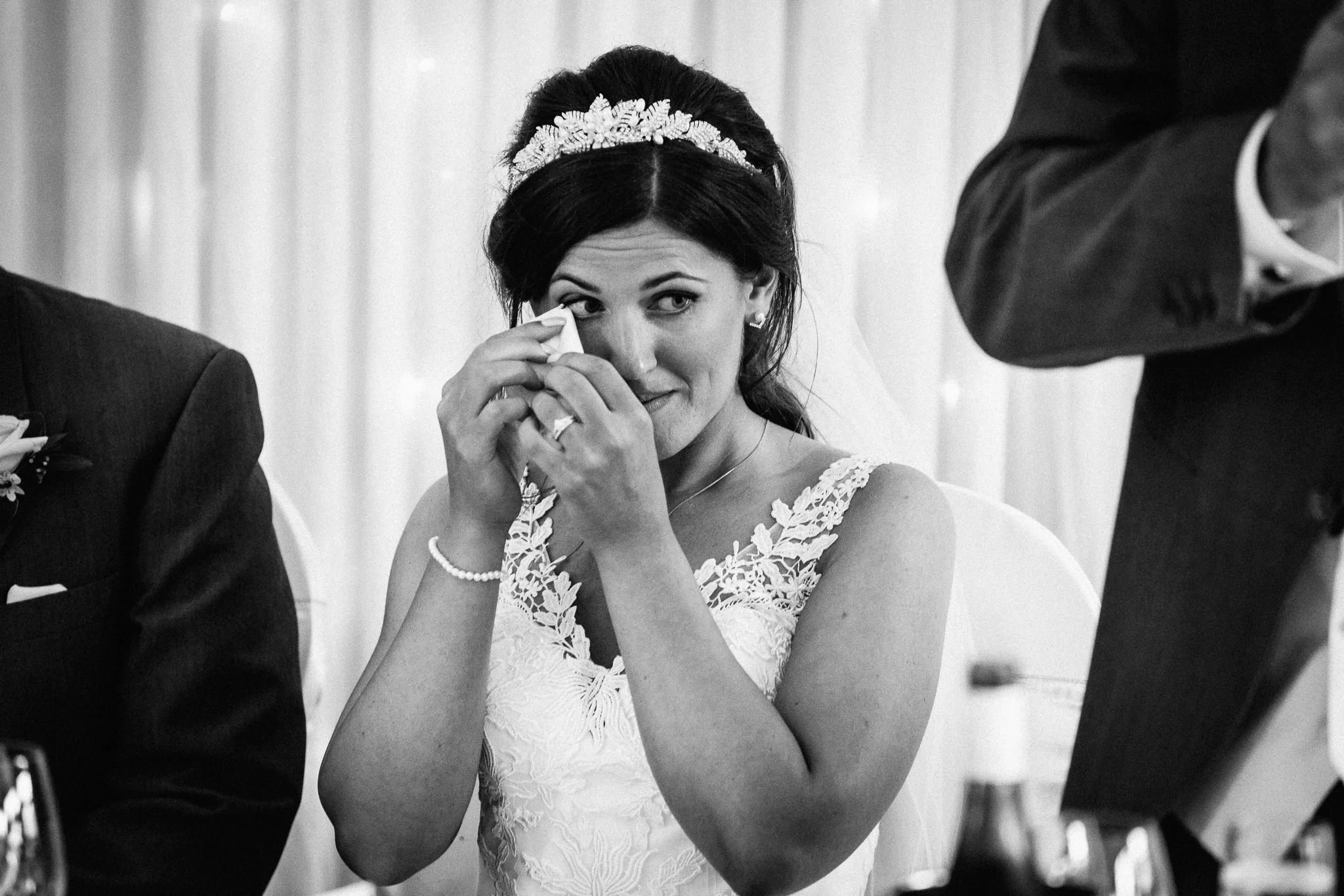  Bride wipes away tear  at Walton Heath Golf Club Surrey 