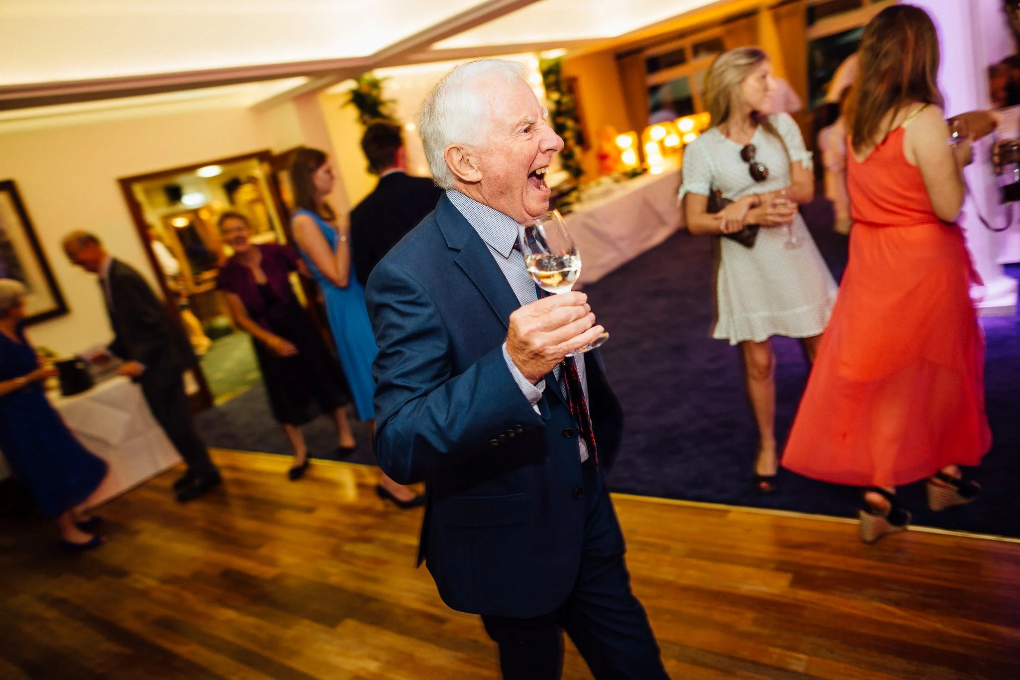  Elderly wedding guest dancing  at Walton Heath Golf Club Surrey 
