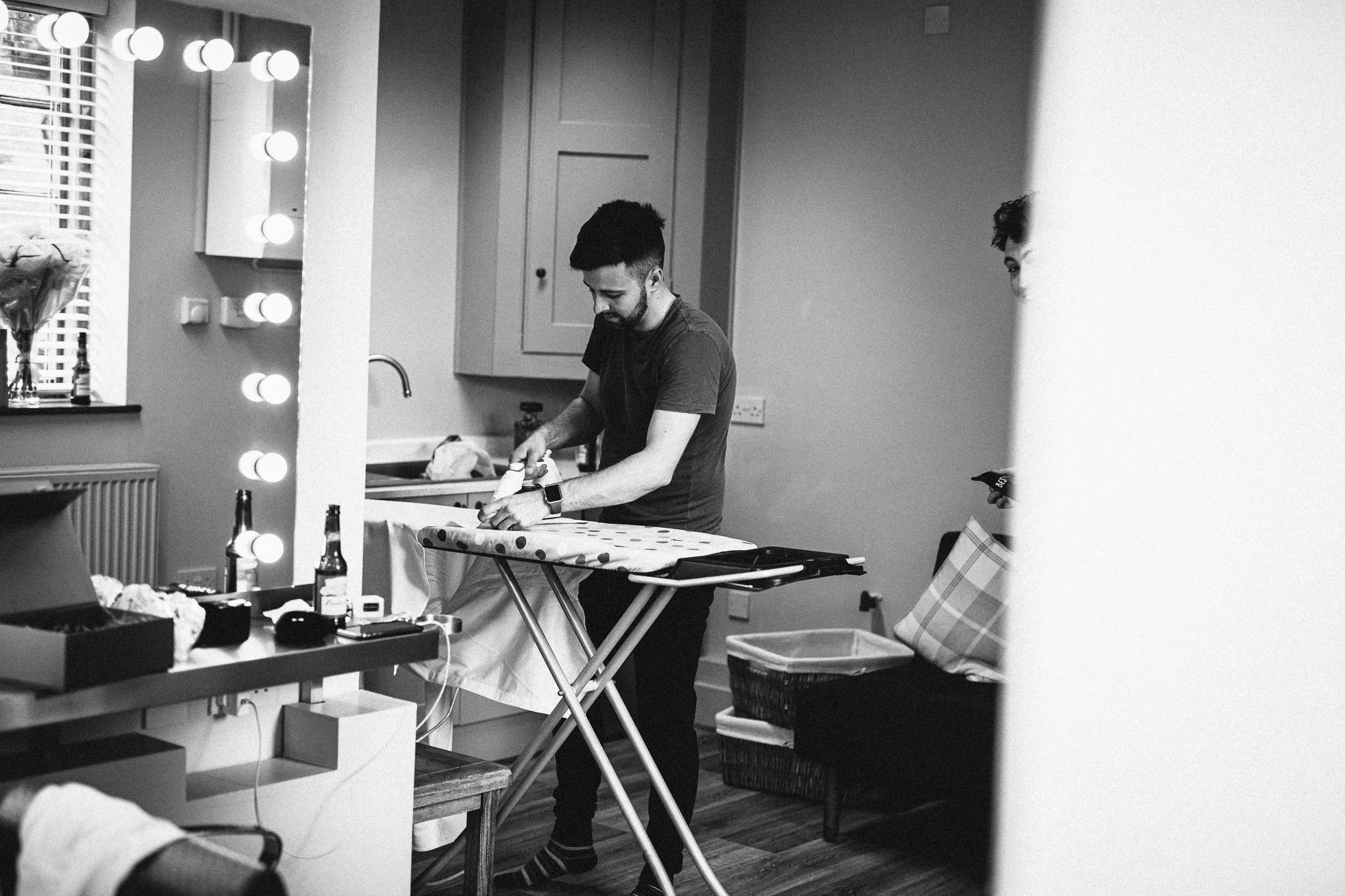  Groom ironing his shirt 