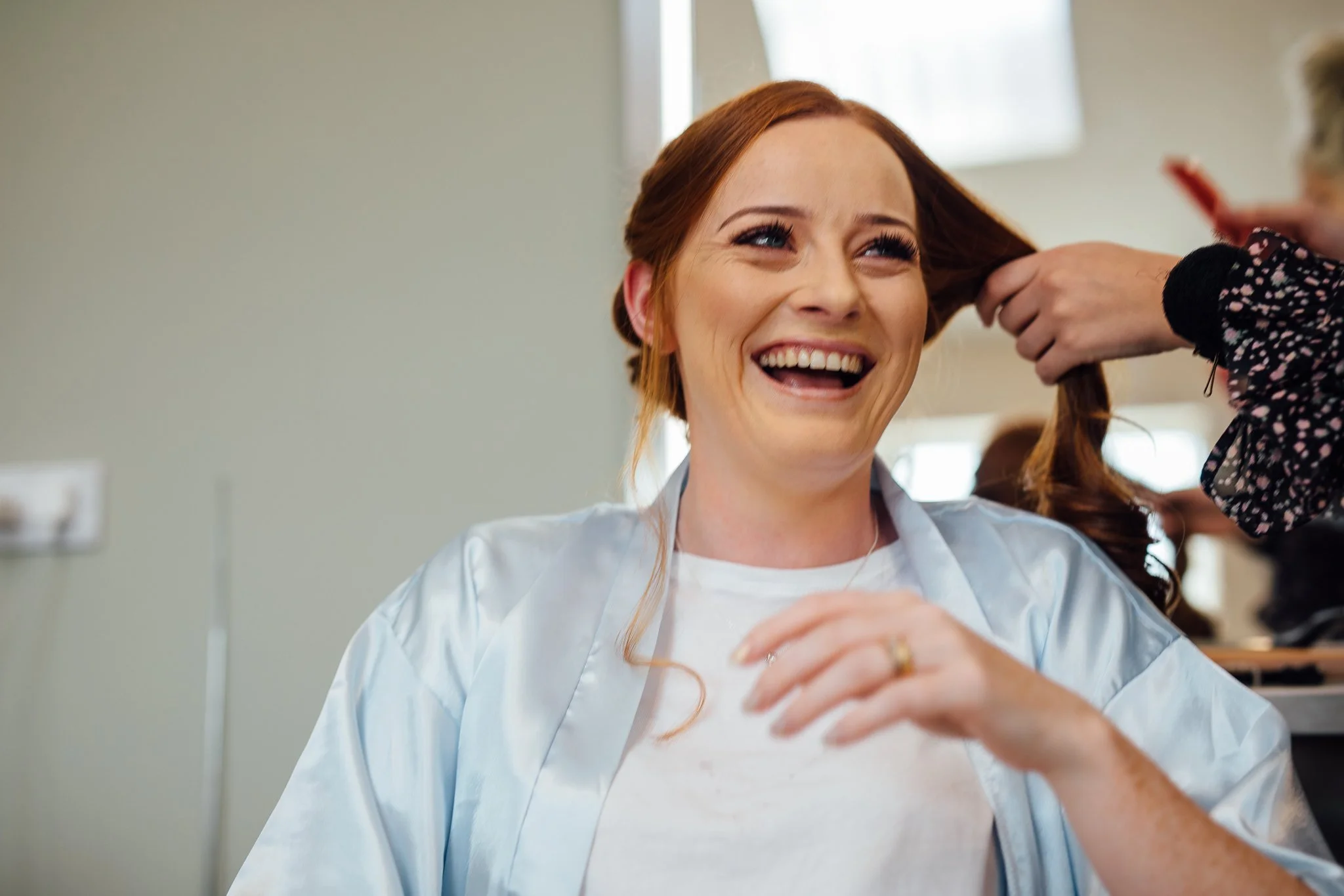  Bridesmaid laughs at Winters Barns Wedding Venue Kent 