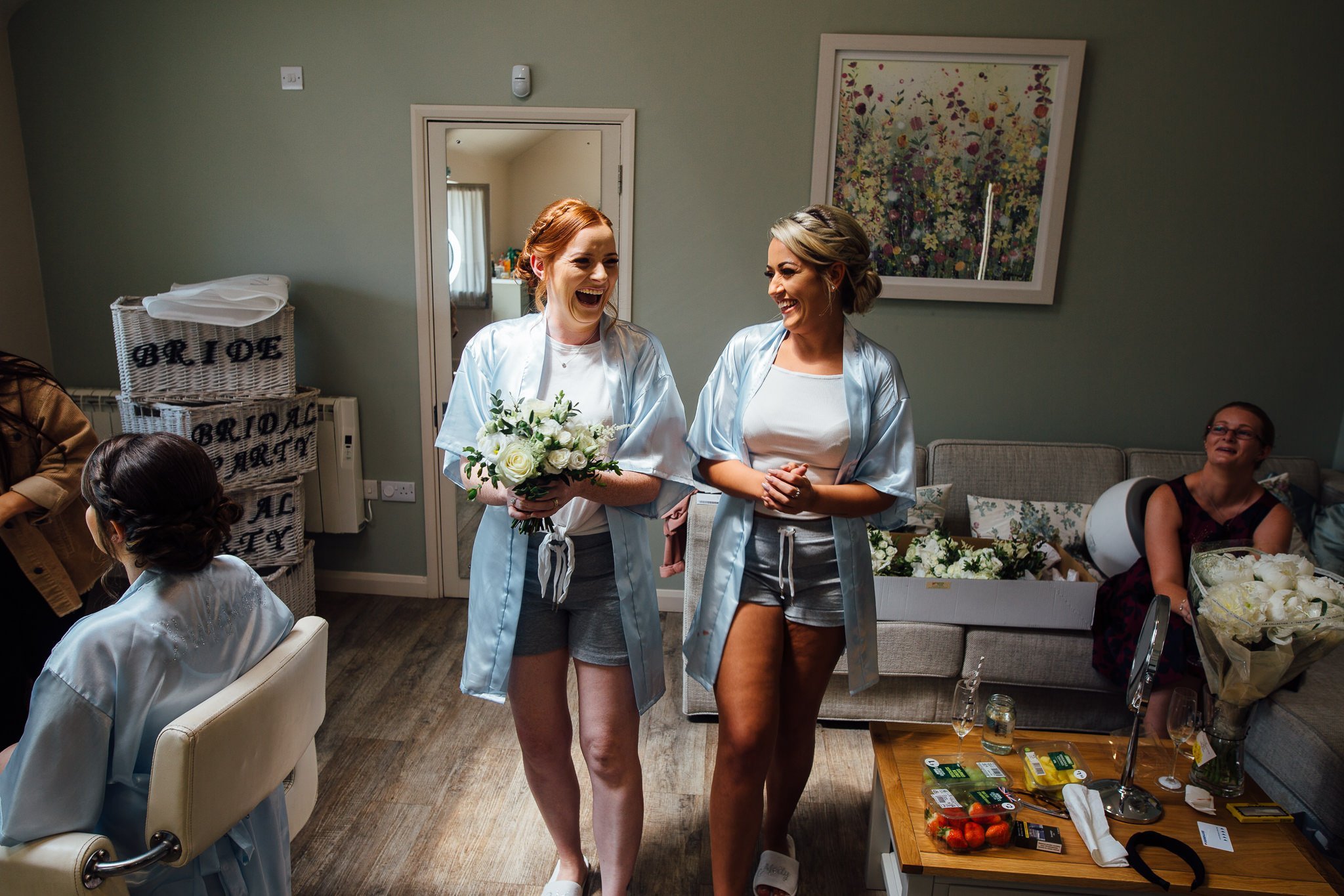  Two Bridemaids laugh as they practice their walk down the aisle at Winters Barns Wedding Venue Kent 