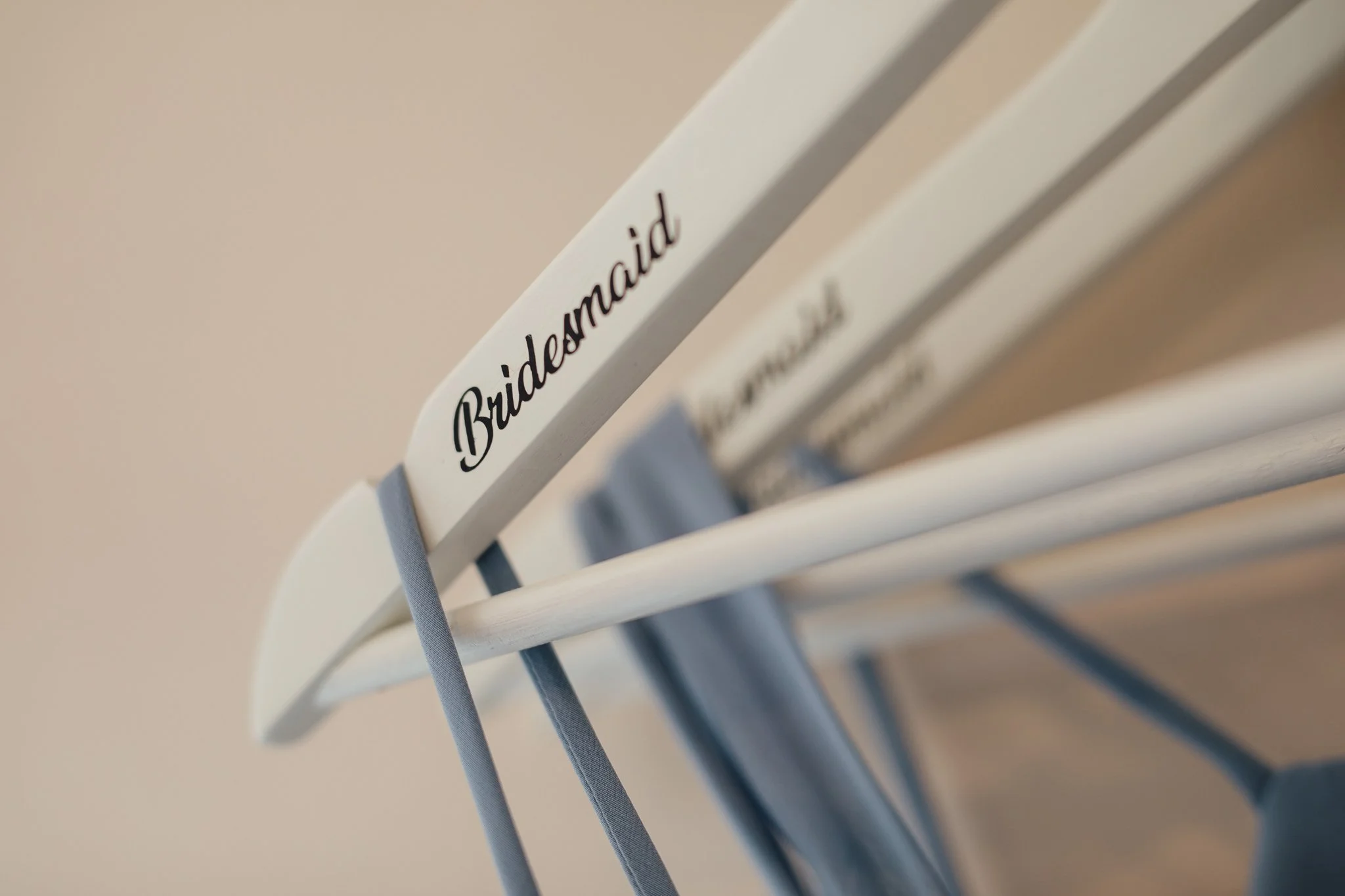  Dress hangers with Bridesmaid written on them 