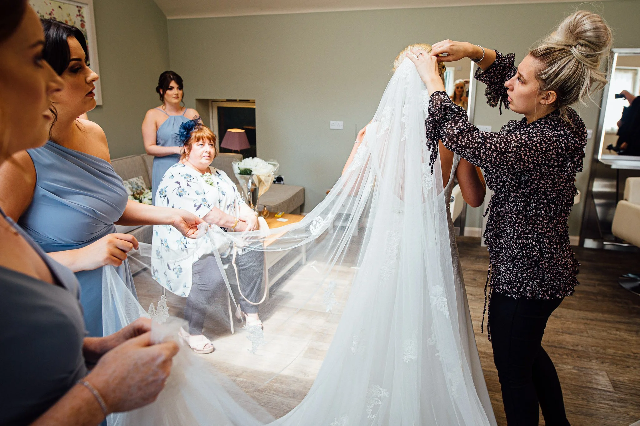  Bride has her veil applied 
