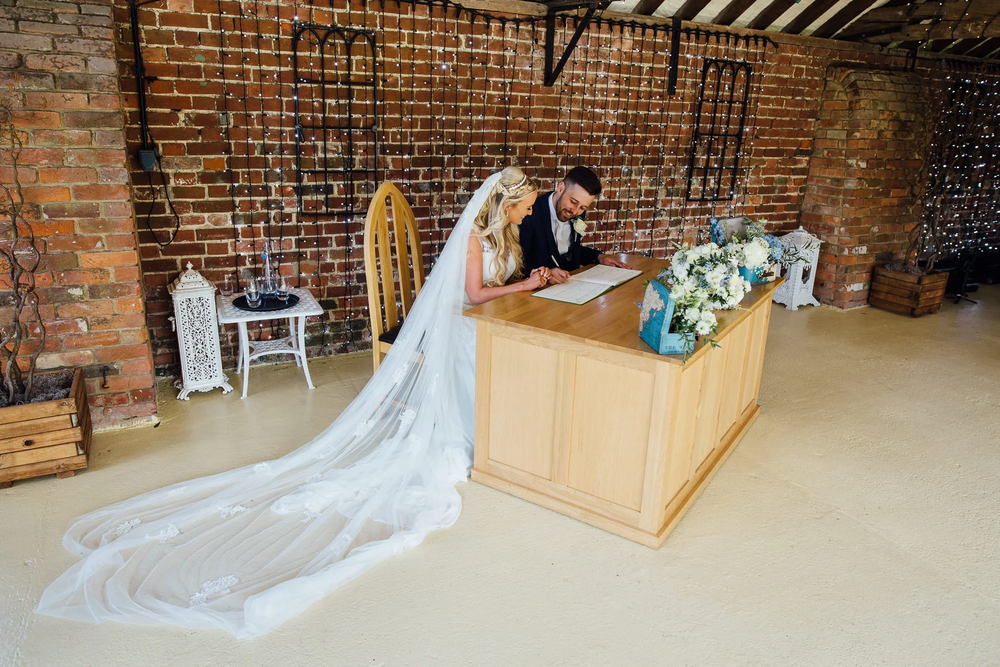  Bride and Groom sign marriage documents 