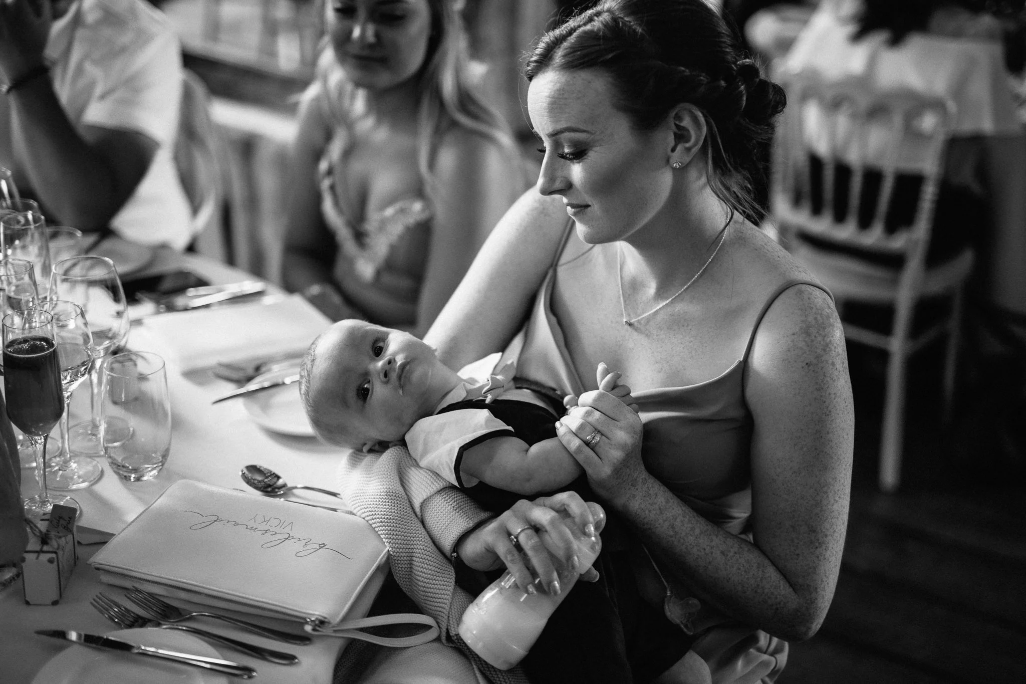  Bridesmaid hold a baby 