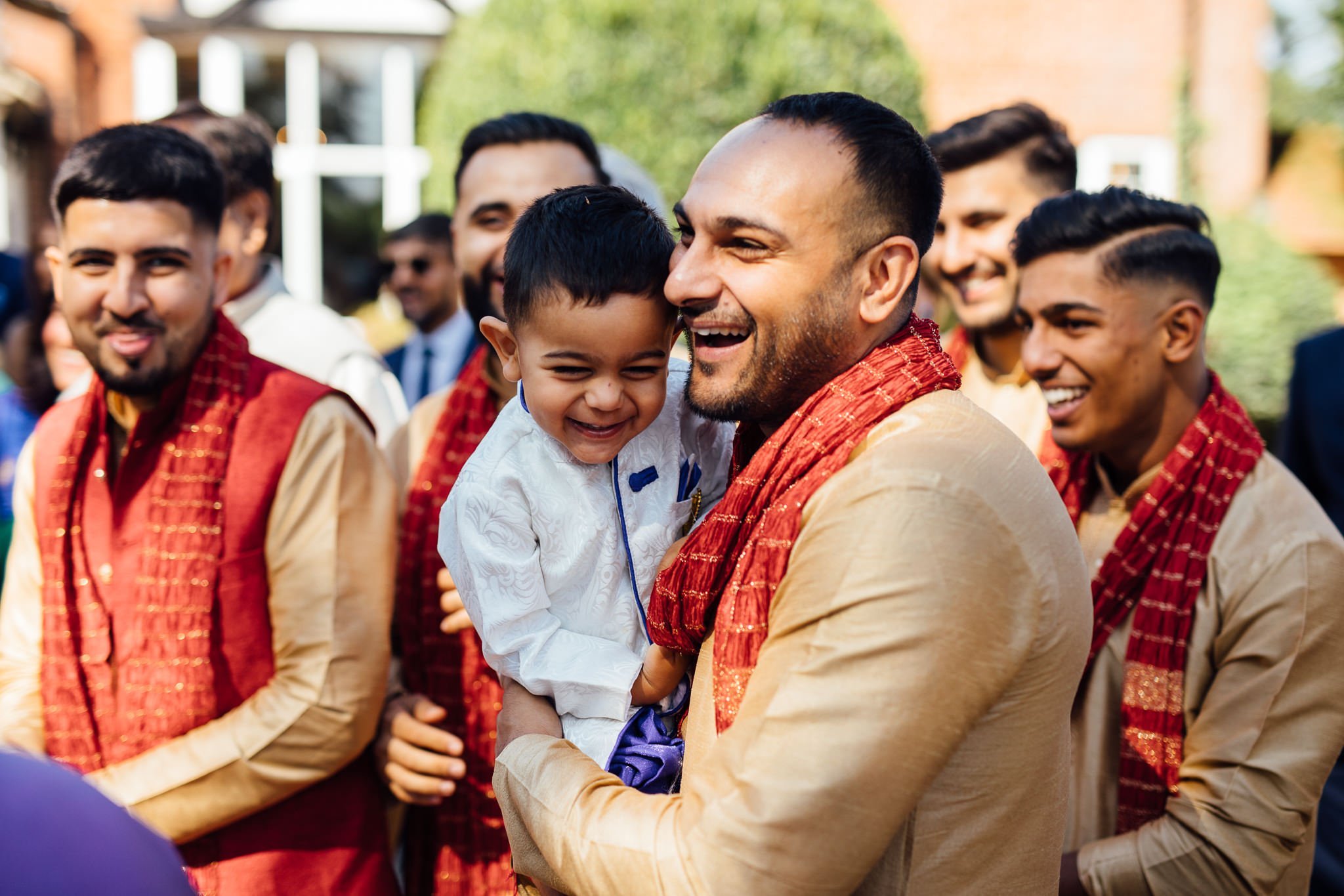  Man laughs with son 