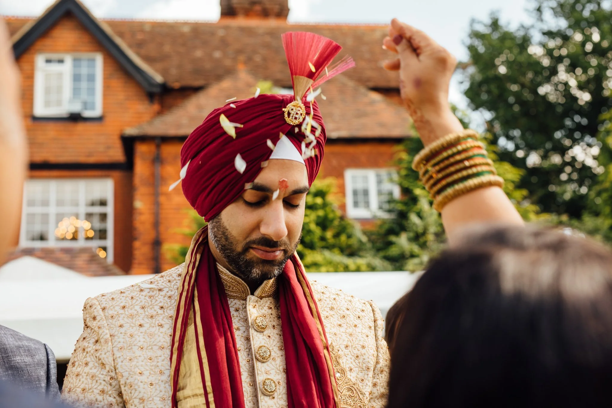  Groom has flowers thrown over his head 