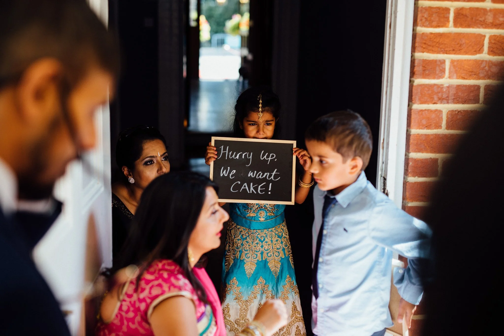  Children hold up a sign 