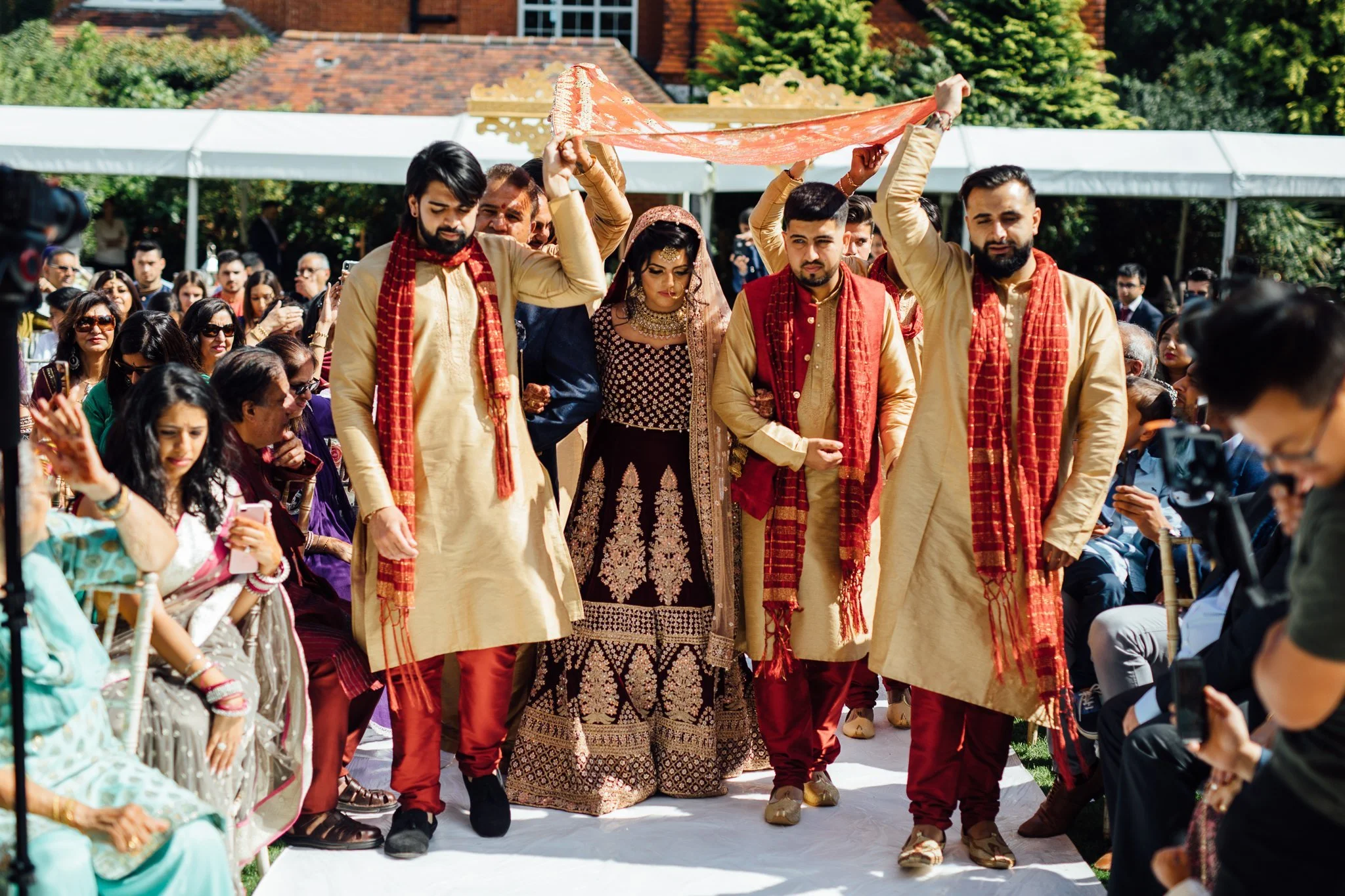  Bride flanked my her father and groomsmen 