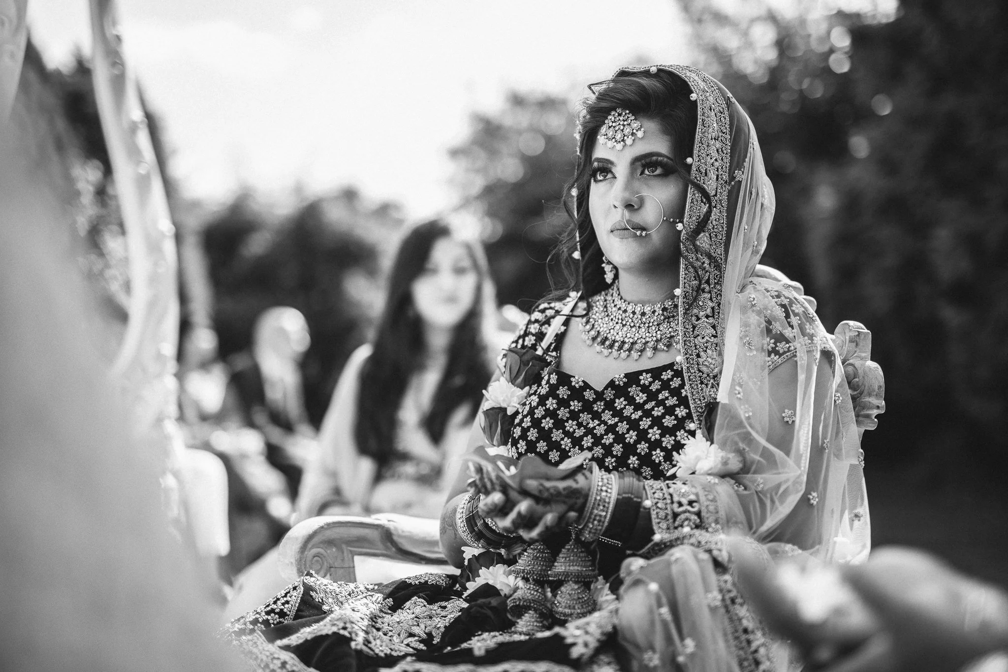  Bride holding leaves during the ceremony 