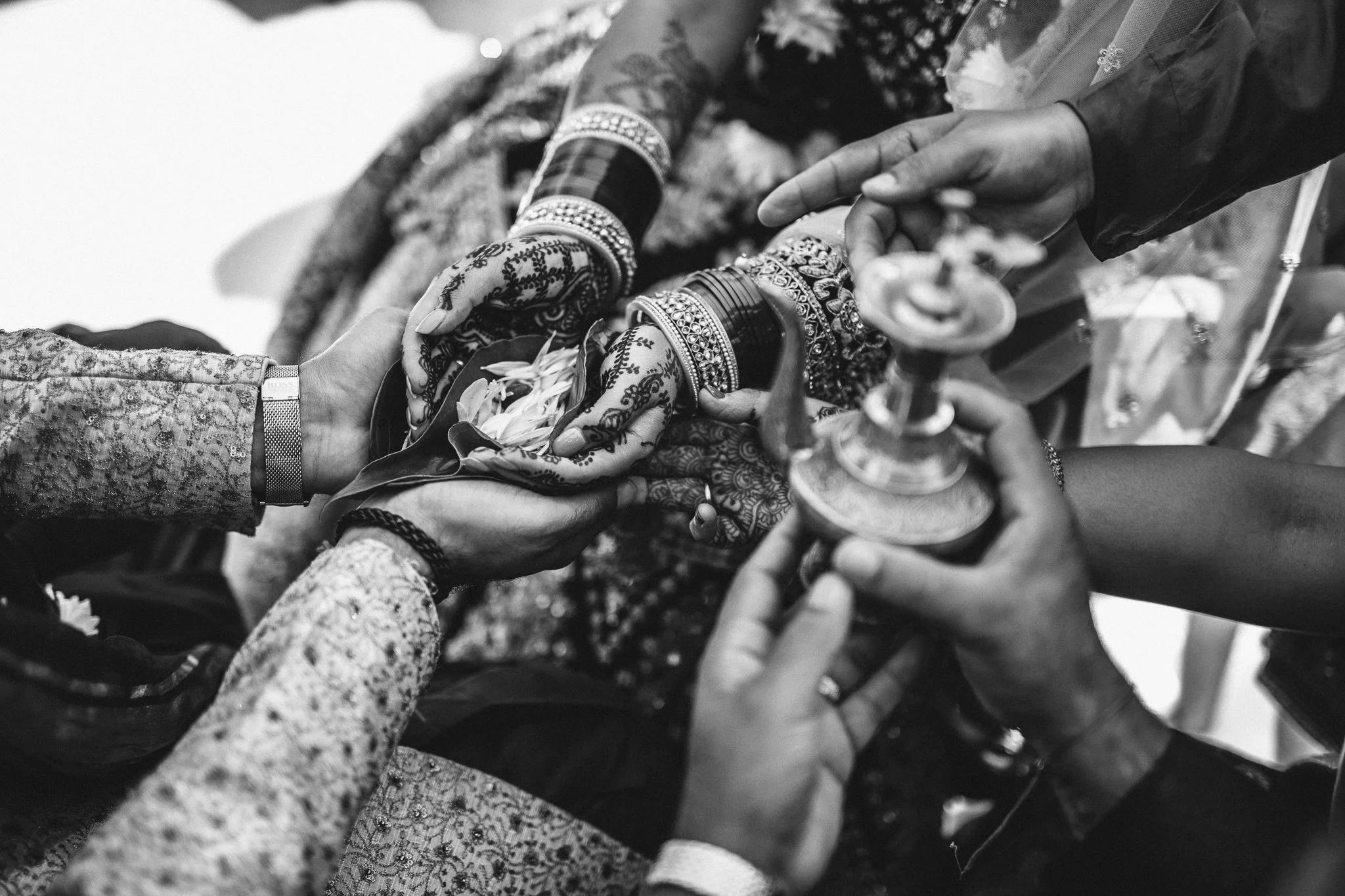  Bride and groom holding petals in their hands 