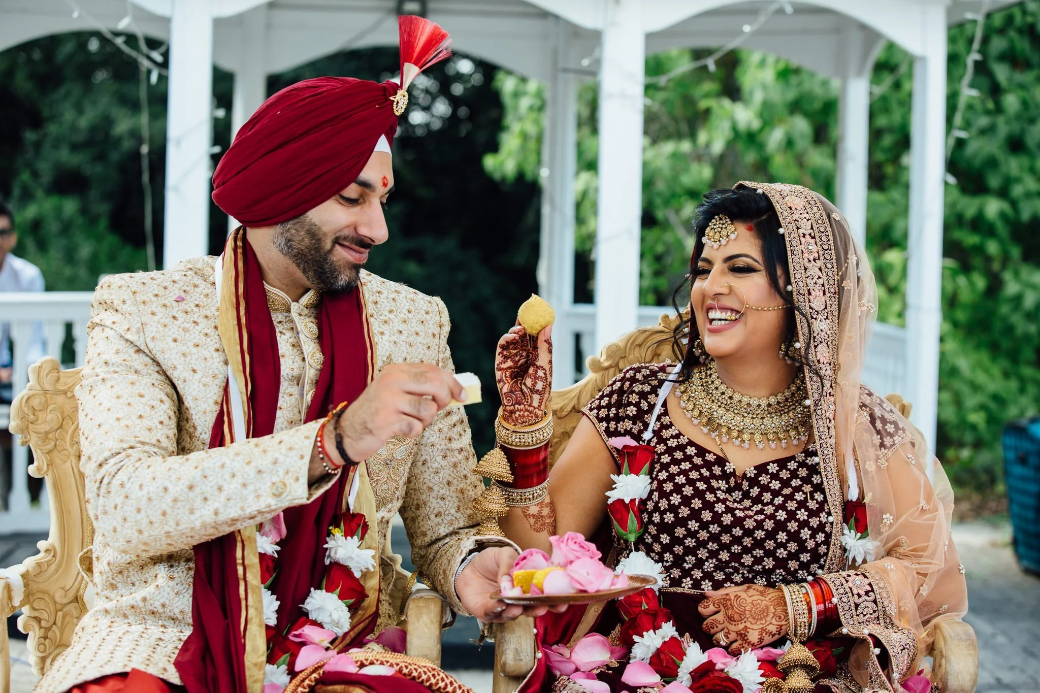  Bride and Groom feeding each other 