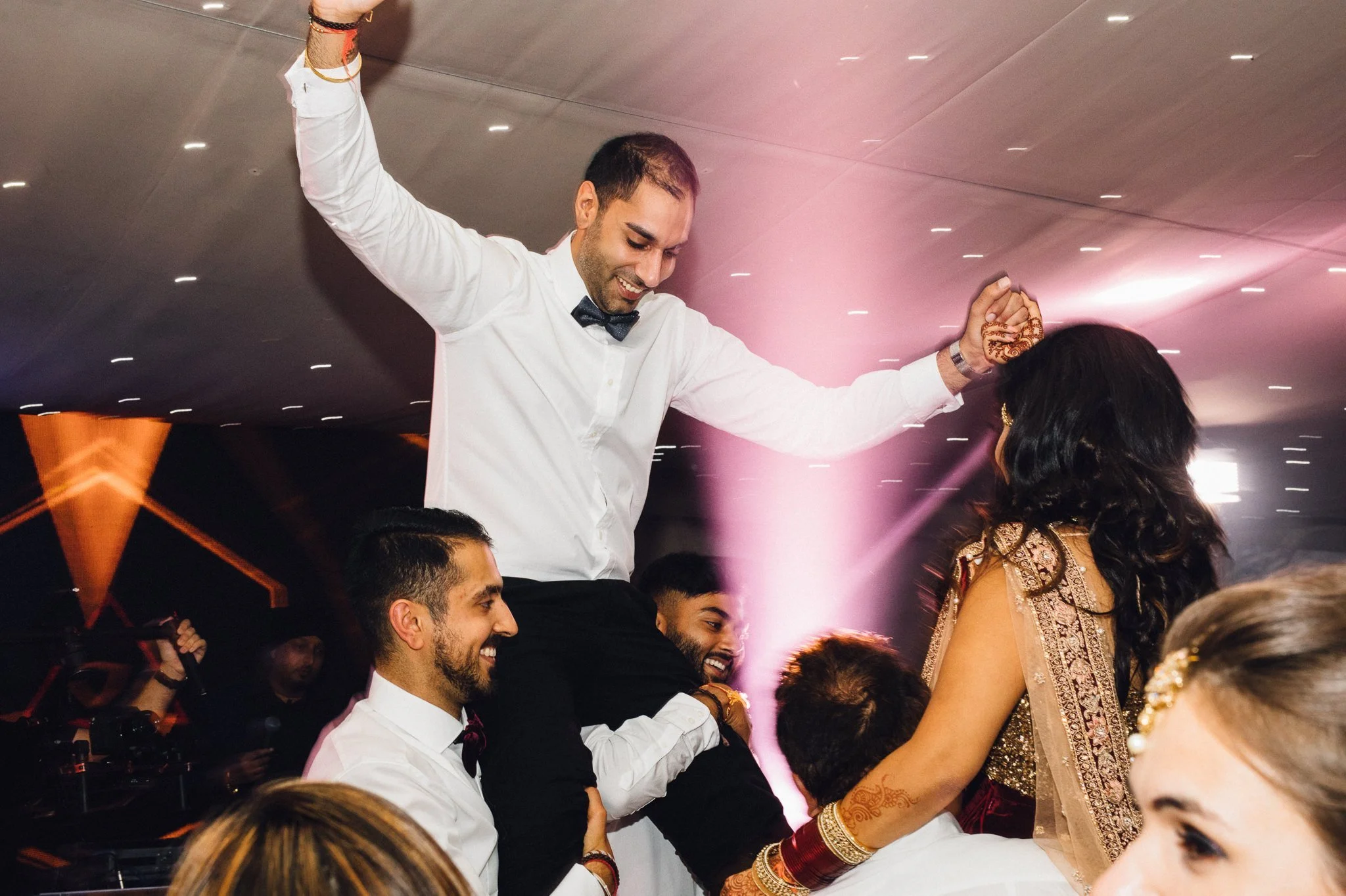  Groom being held aloft 