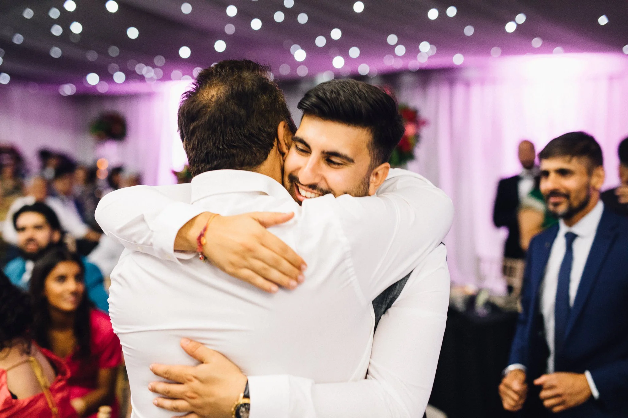  Two men hugging 