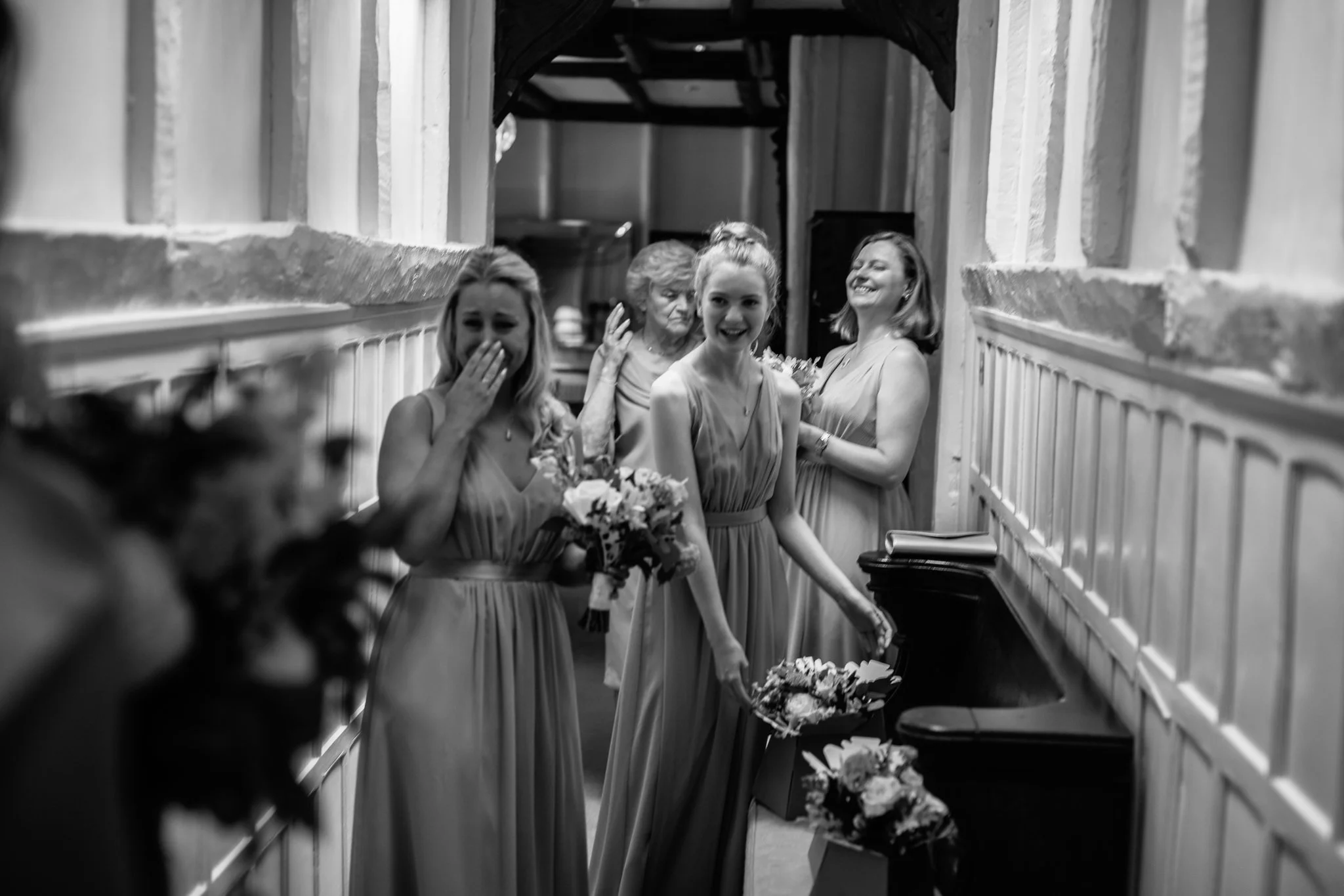  Reaction of bridesmaids at seeing bride in her dress 