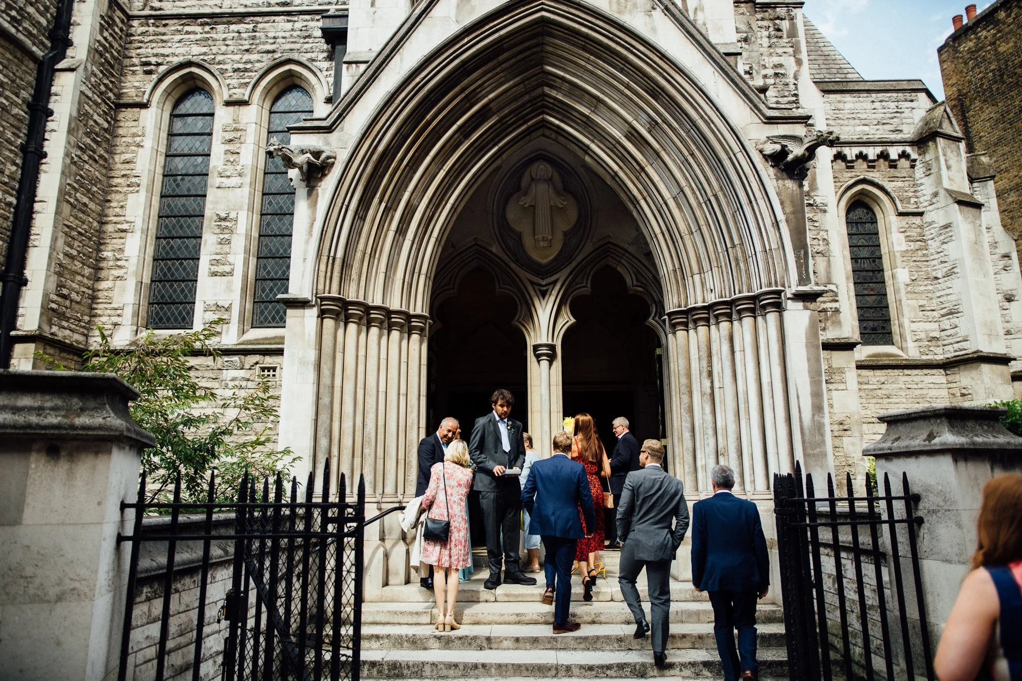  Guest walk up the steps outside St James Church, Spanish Place Marlyborne 