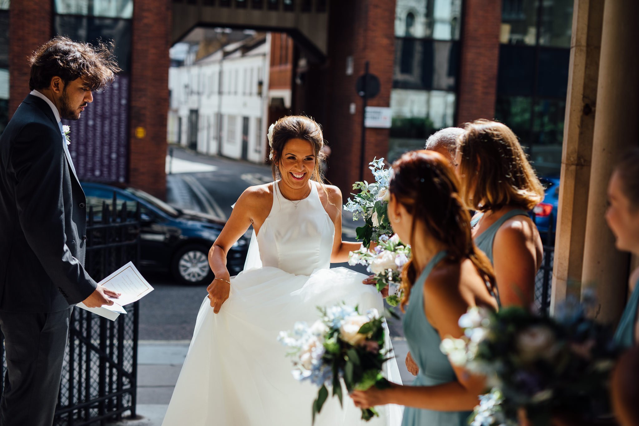  Bride smiling at her bridal party 