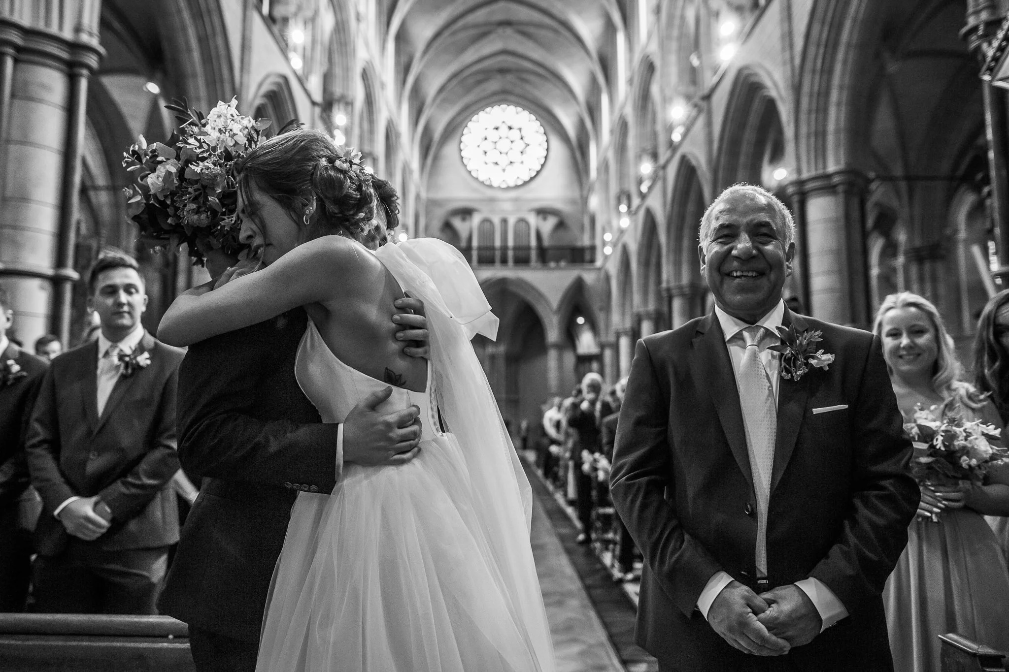  Bride and Groom hug at St James Church, Spanish Place Marlyborne 