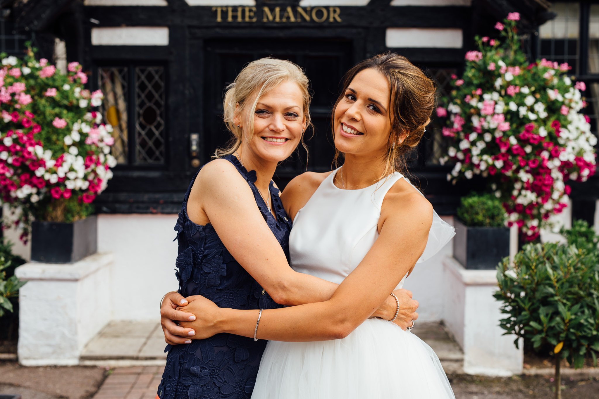  Bride and her mother smiling 