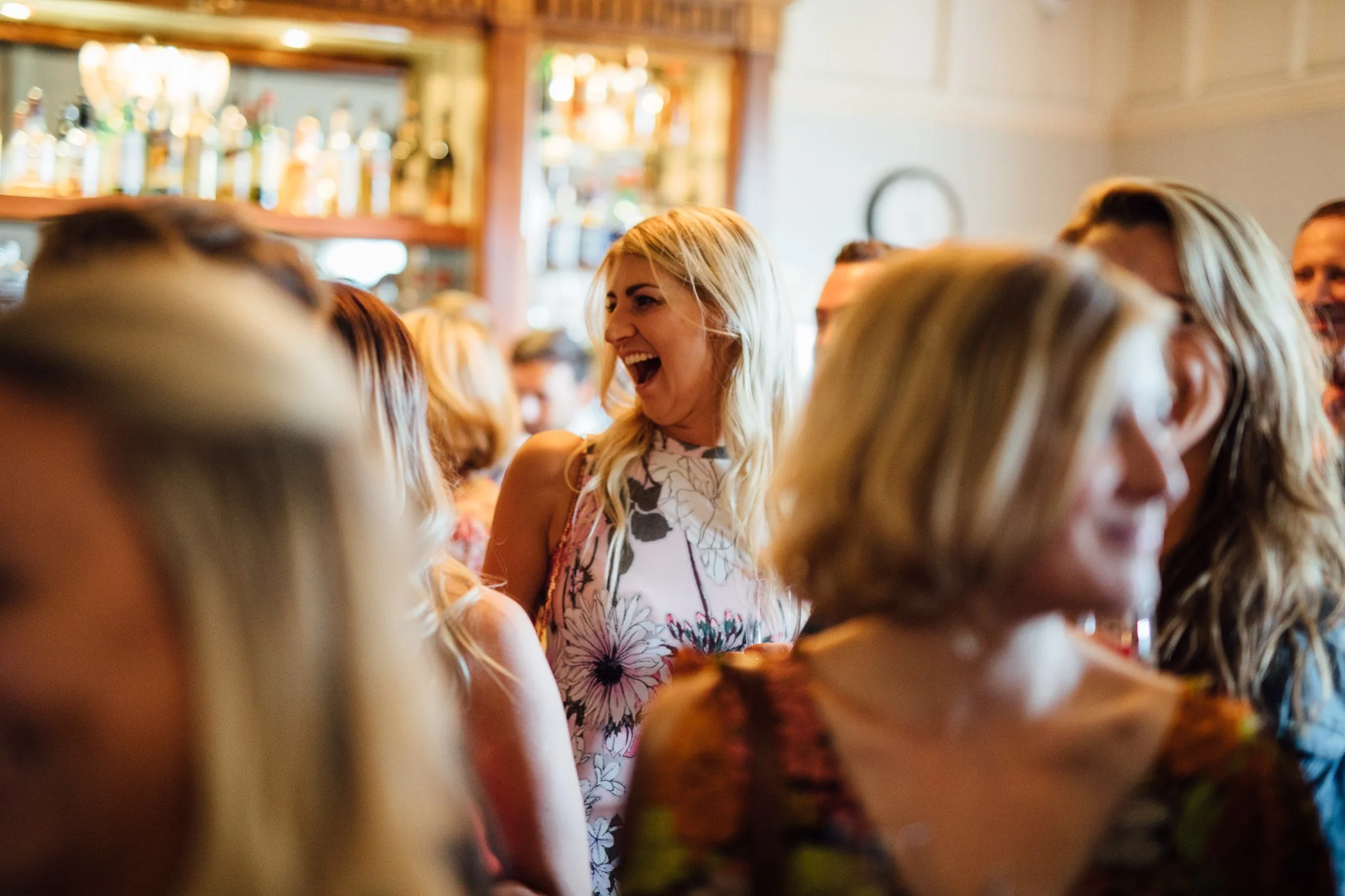 Guest laughing at a speech at Laura Ashley The Manor Elstree 