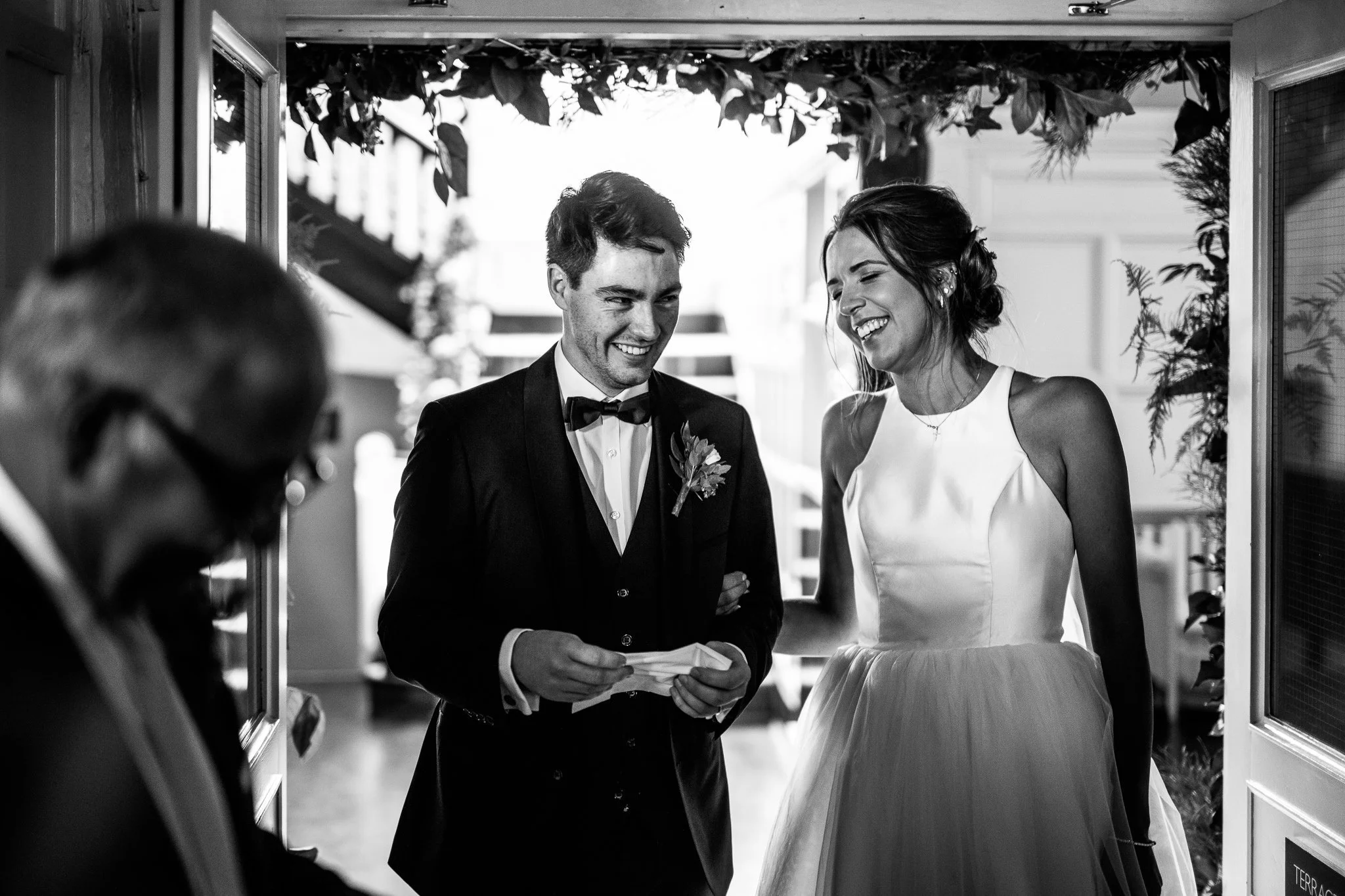 Bride and Groom laughing at Laura Ashley The Manor Elstree 