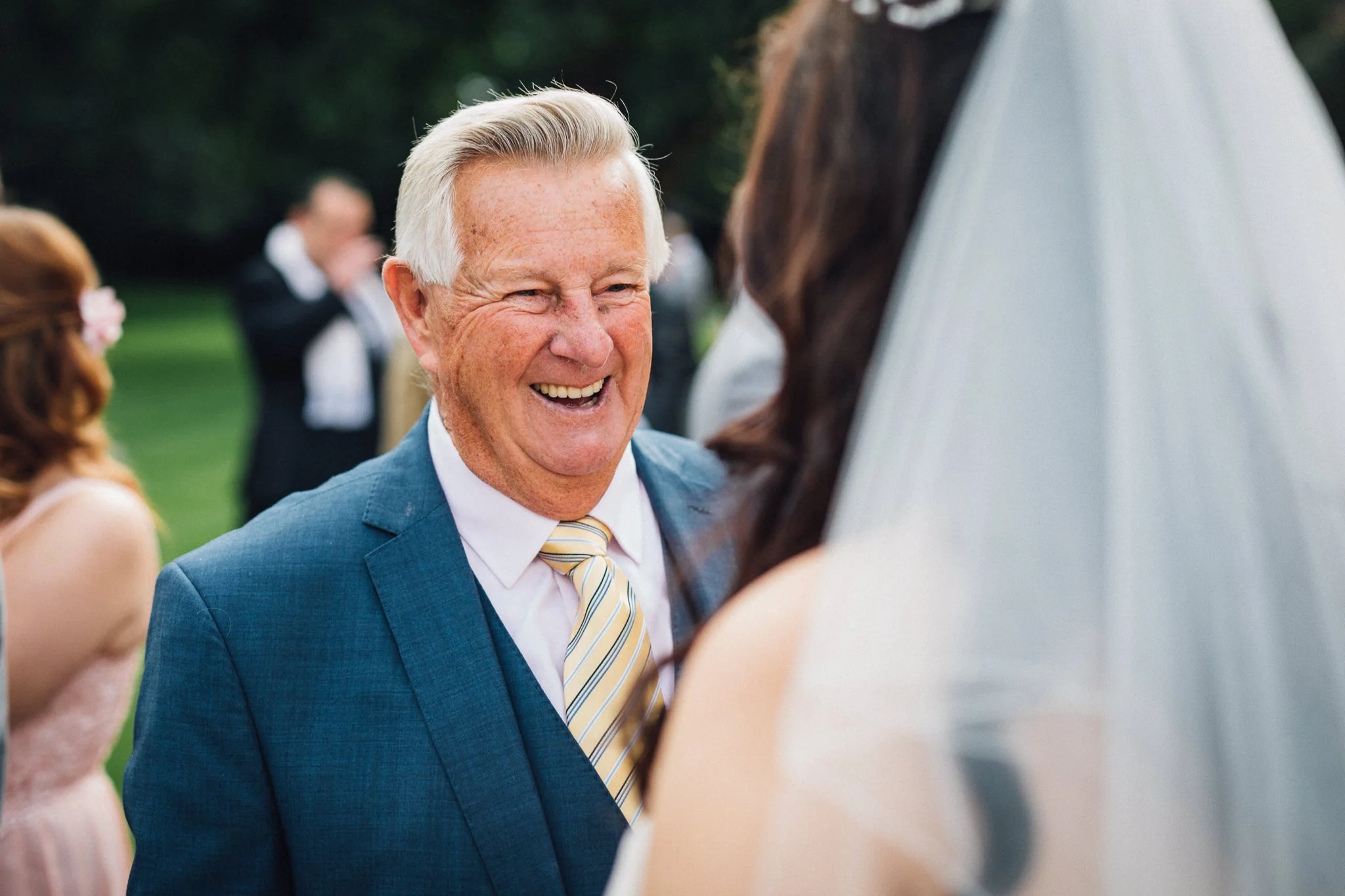  Wedding guest smiling at Bride at Warren House Hotel Kingston upon Thames 