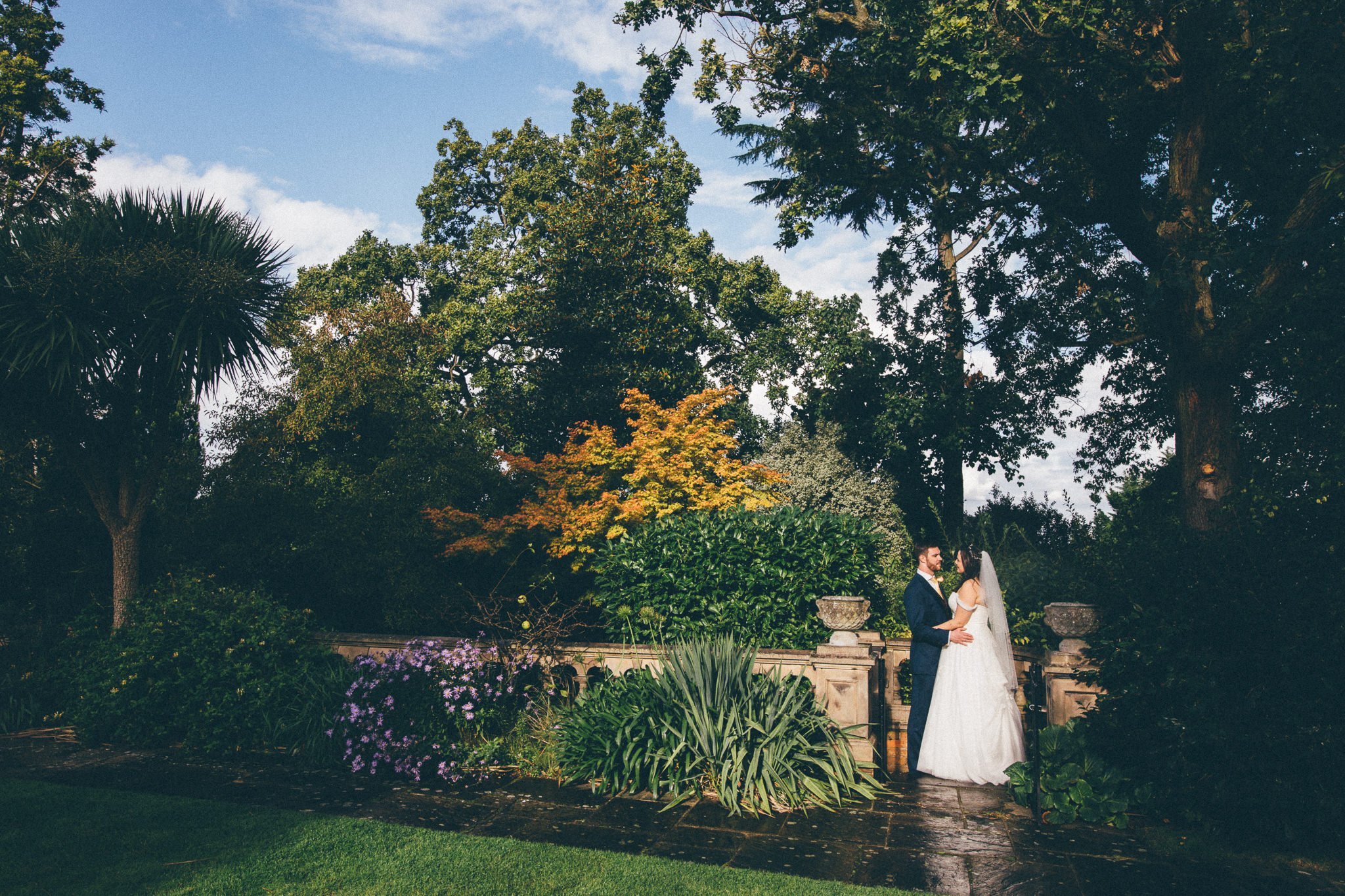  Bride and Groom pose for a portrait at Warren House Hotel Kingston upon Thames 