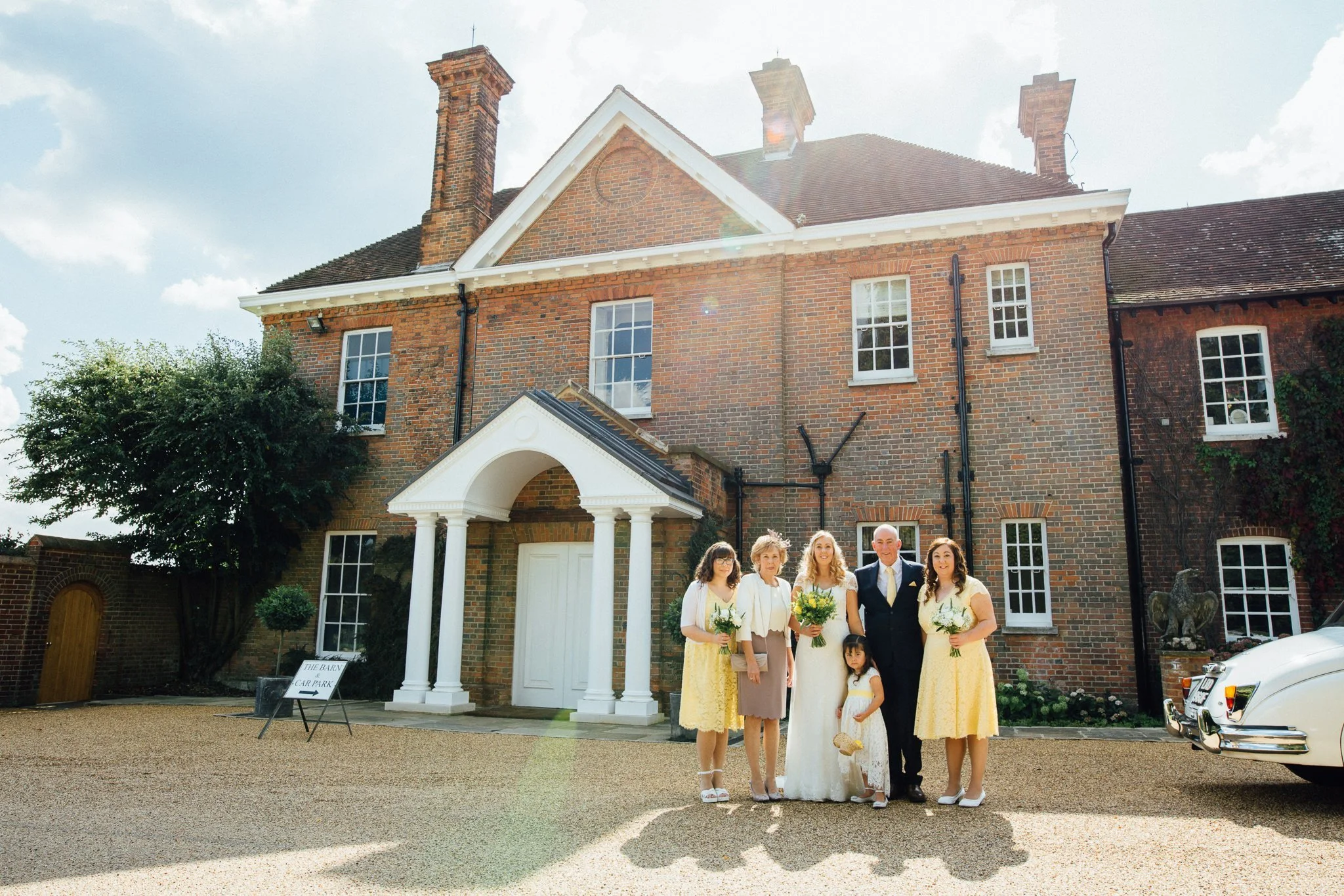  Bride and Bridal party outside of Micklefield Hall 