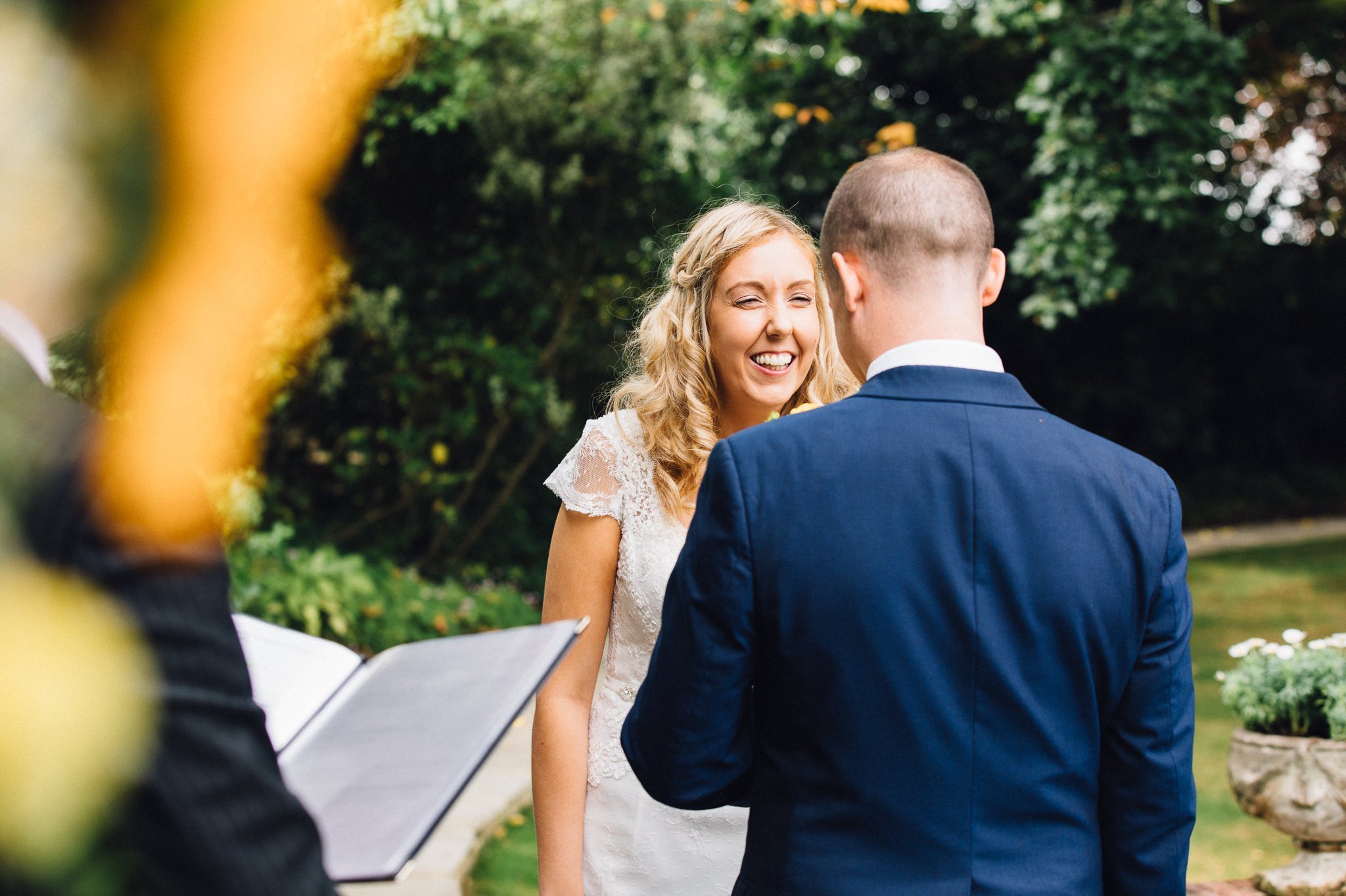  The Bride smiling during her wedding ceremony at Micklefield Hall 