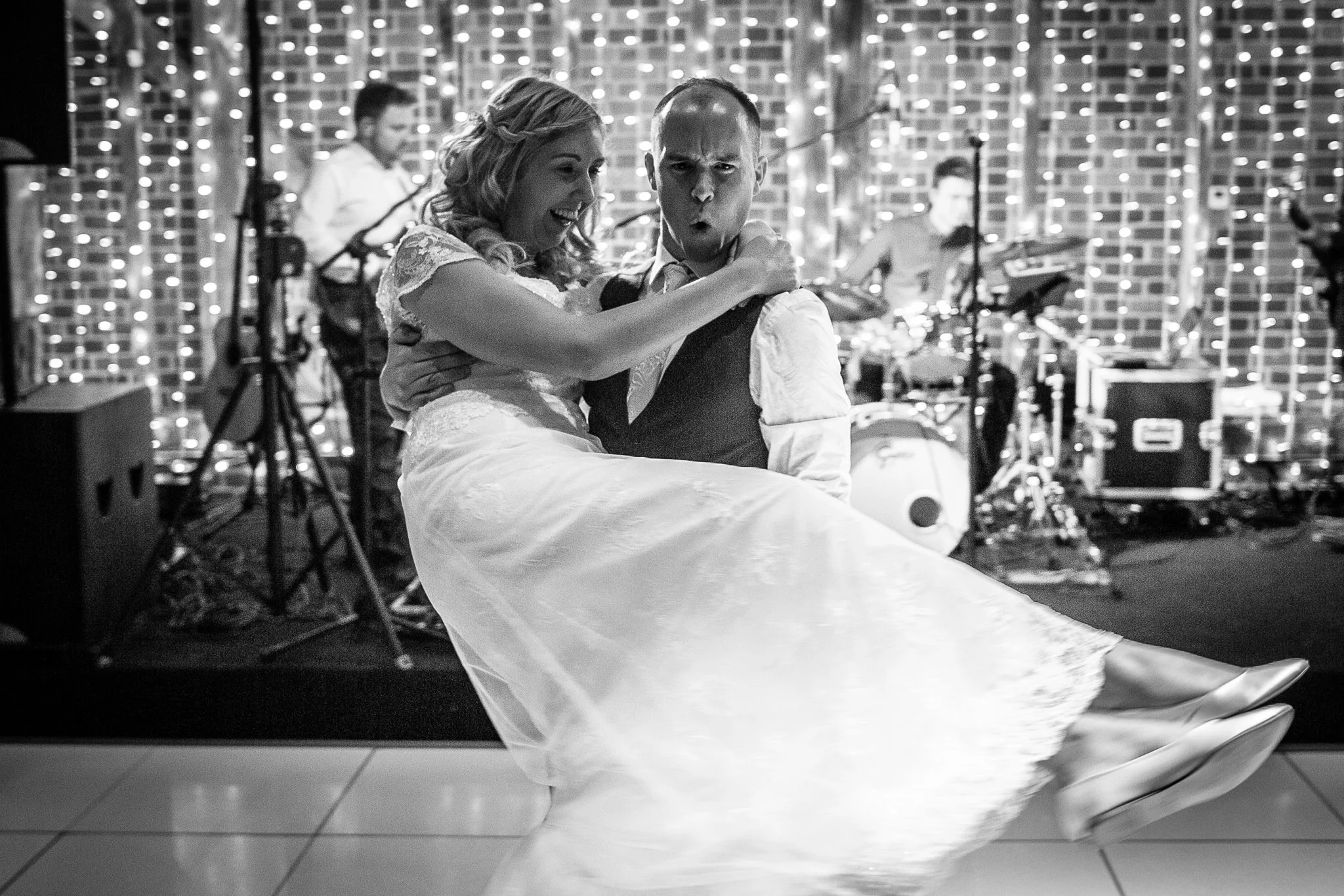  Groom picks up the bride during their first dance 