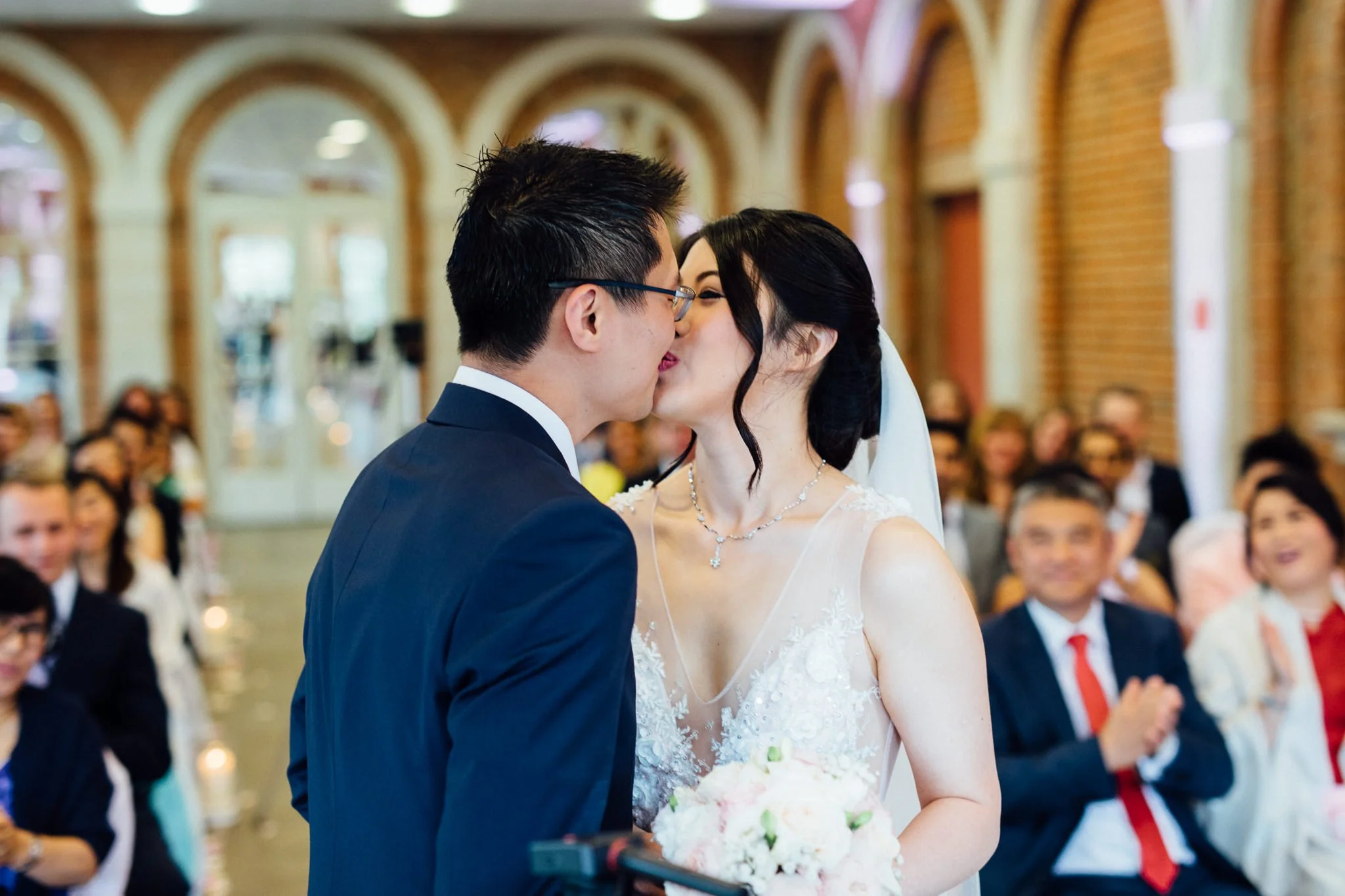  Bride and Groom kiss on their wedding day Great Fosters Egham 