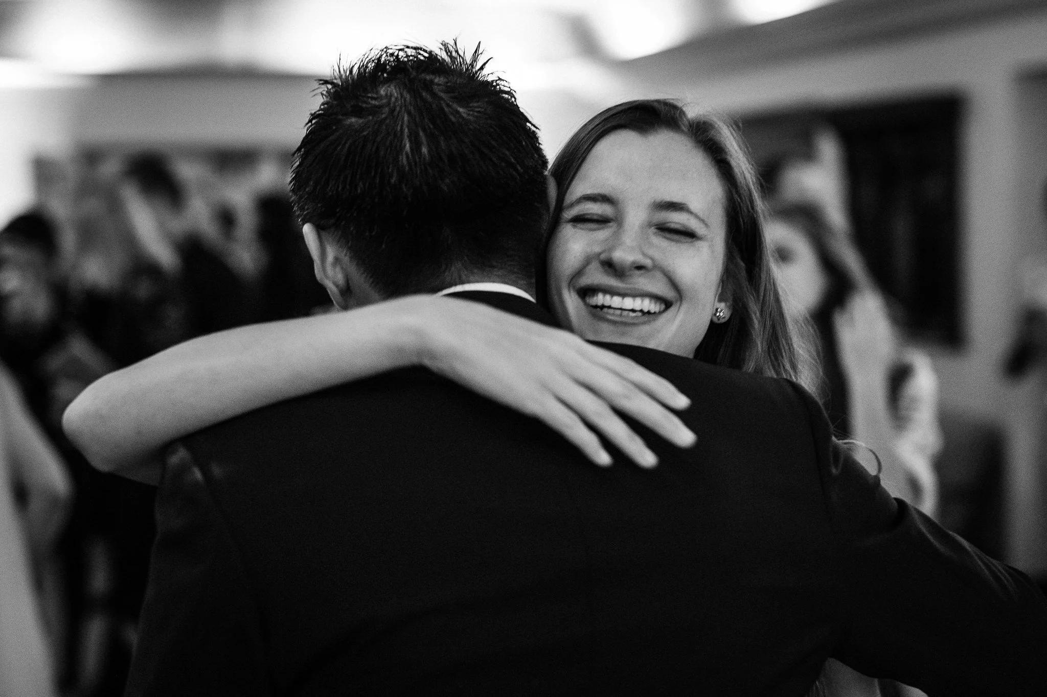  Guest hugs the bride 