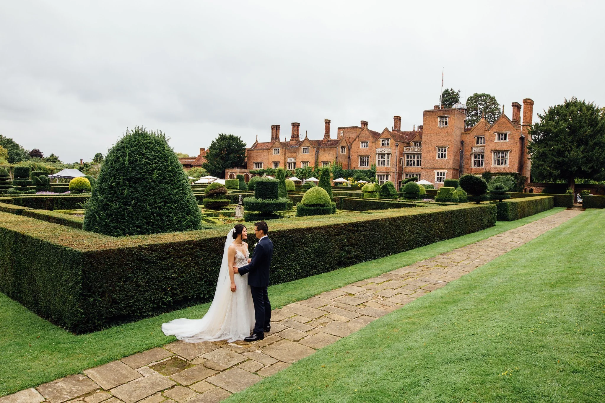  Bride and Groom with Great Fosters Egham in the background 