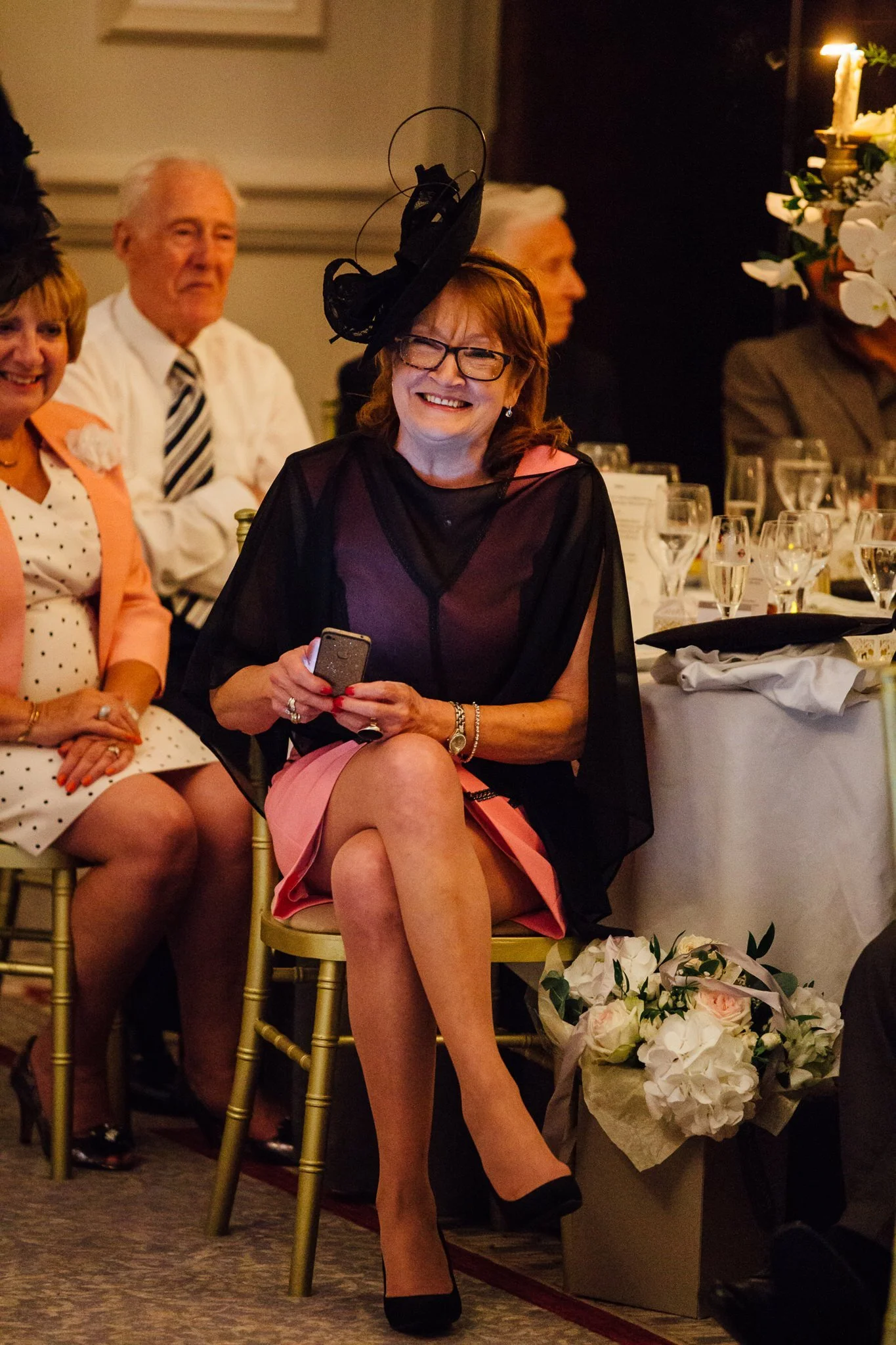  Female guest smiling during the speeches 